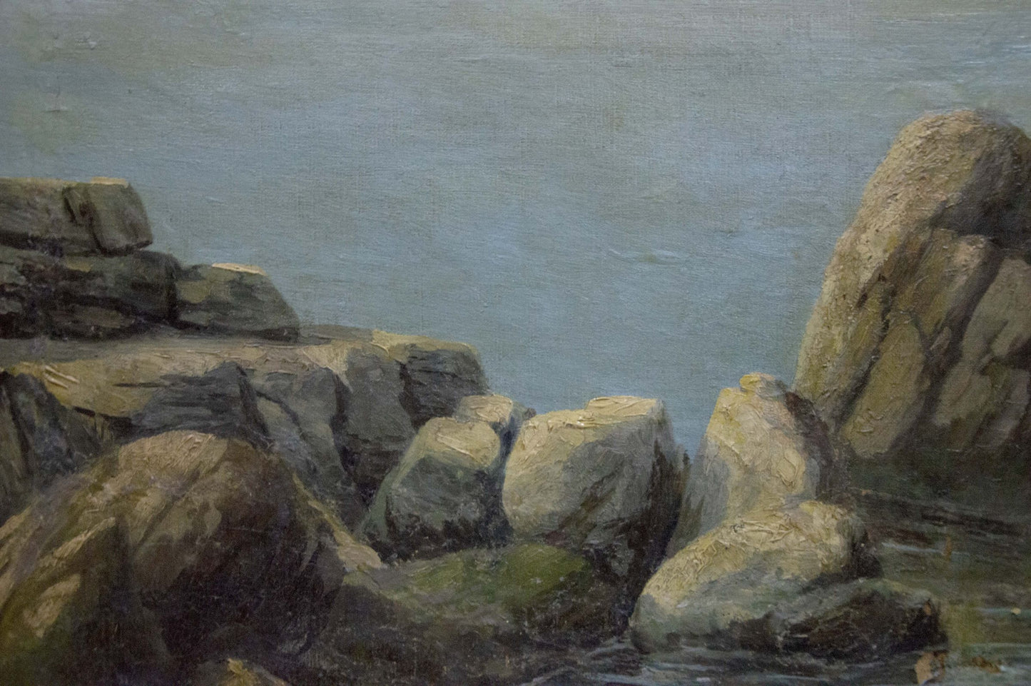 Oil painting Coast: rough gray rocks with green moss on calm blue shoreline