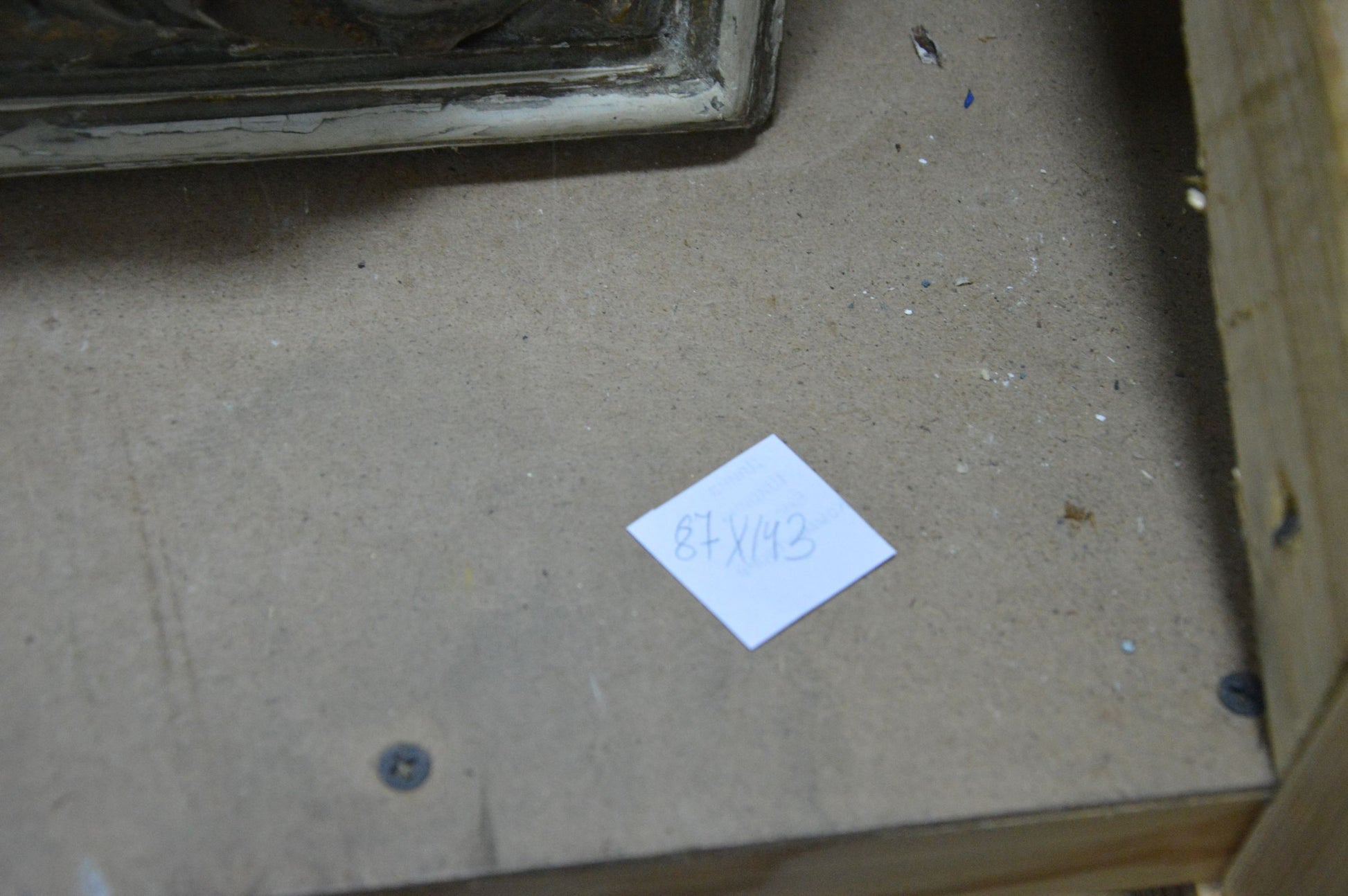 Back of Oil painting Coast product showing handwritten 87x42 dimensions note