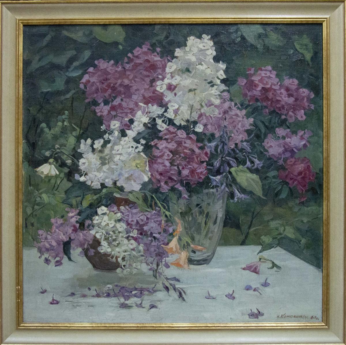 Oil painting of vibrant purple and white lilacs in vase by Nadezhda Kompaniyets-Kiyanchenko