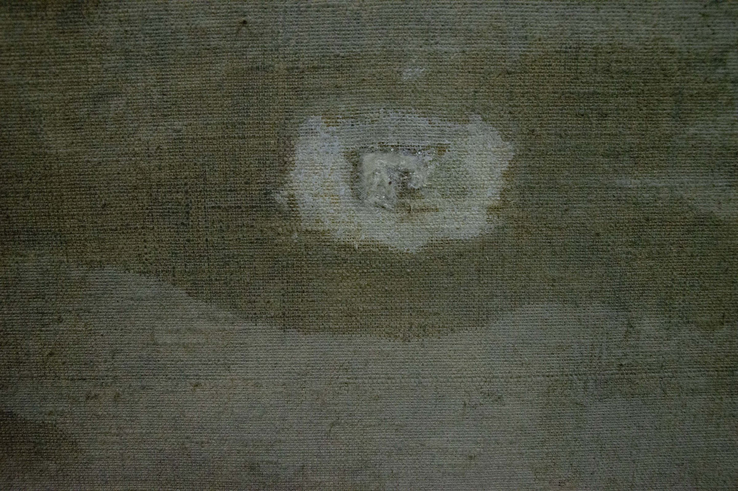 Back of Oil painting Lilac by Nadezhda Kompaniyets-Kiyanchenko with worn gray fabric and central white damage