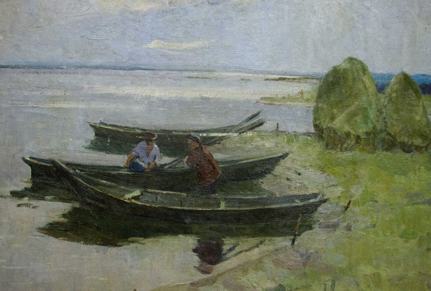 Oil painting Near the shore by Sevastyanov Victor Grigorievich: dark rowboats with two figures