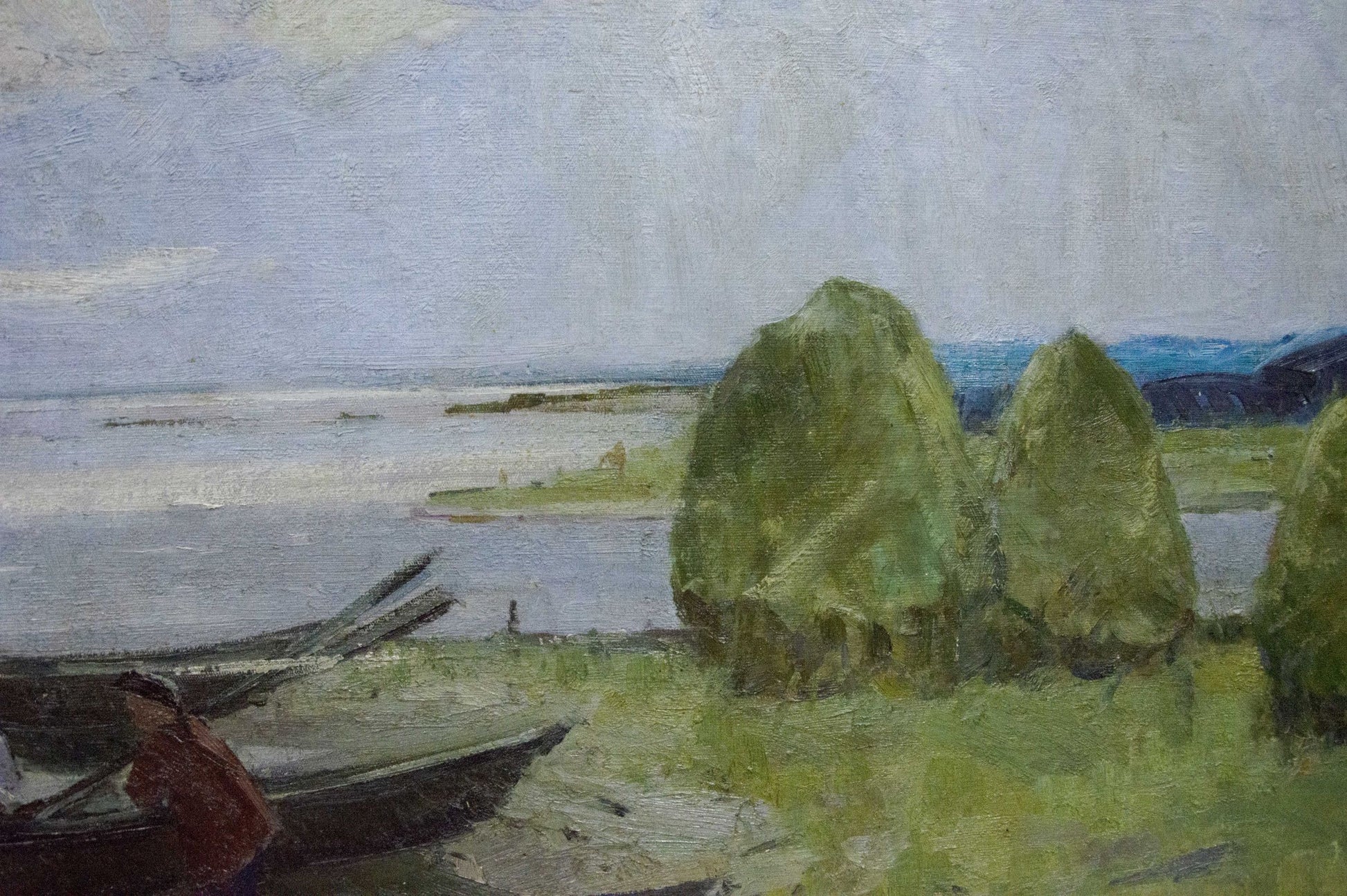 Oil painting Near the shore by Sevastyanov Victor Grigorievich, hay bales by water