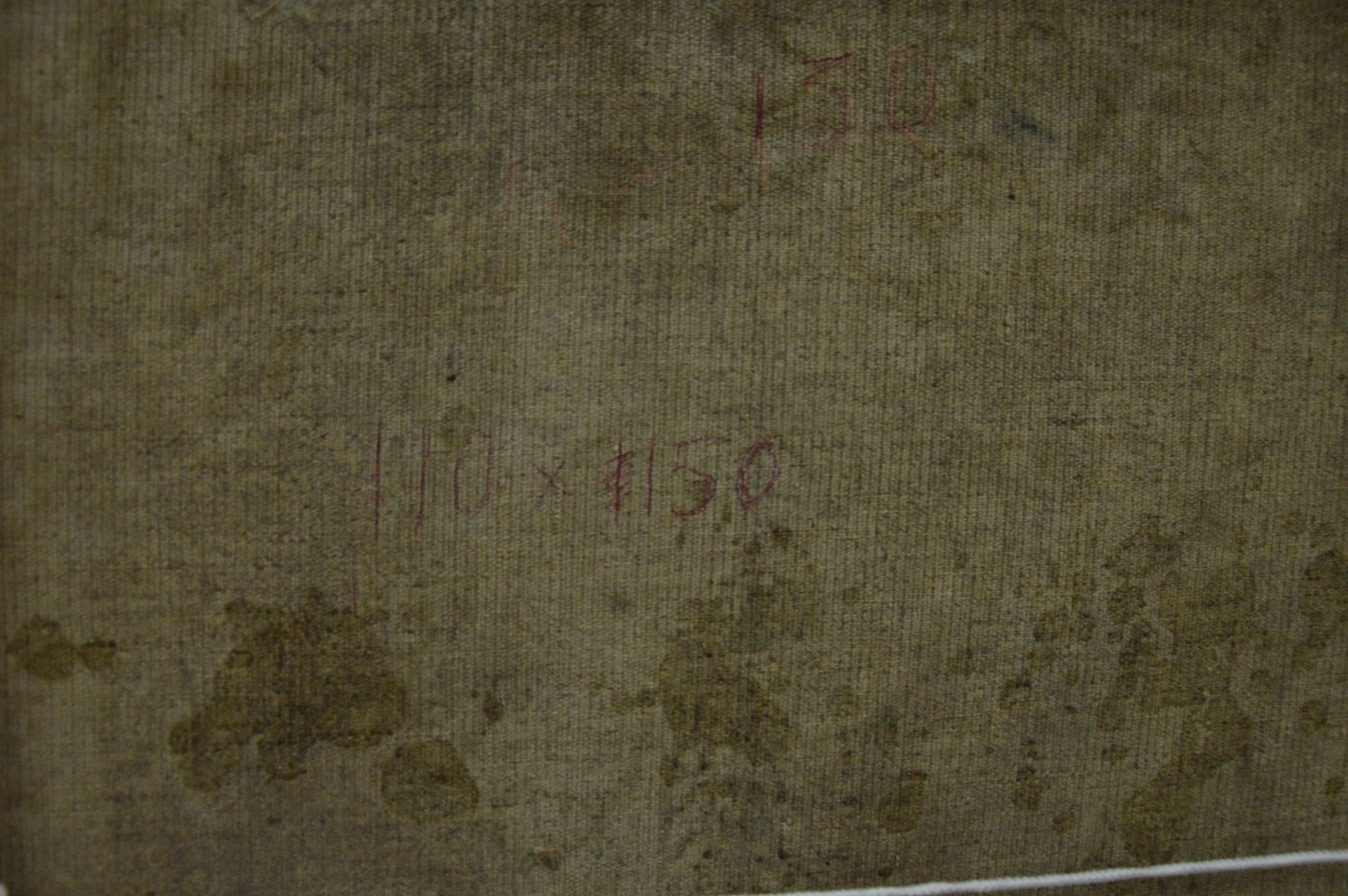 Back of oil painting by Khomko Vasily Efremovich: worn olive-green canvas with faded red markings and dark stains