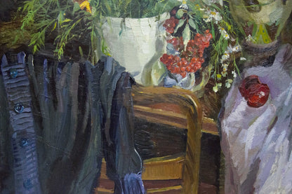 Dark blue textured jacket with metallic buttons on wooden chair in Ivchenko still life painting