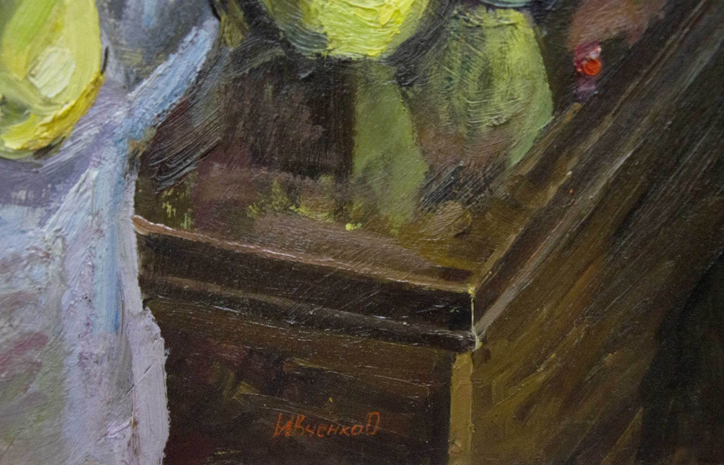 Back of oil painting by Ivchenko Anatoly Avramovich on textured wooden table corner
