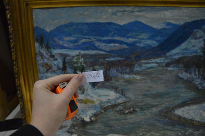 Hand holding tape measure labeled 70x82 in front of Kontratovich Winter landscape oil painting