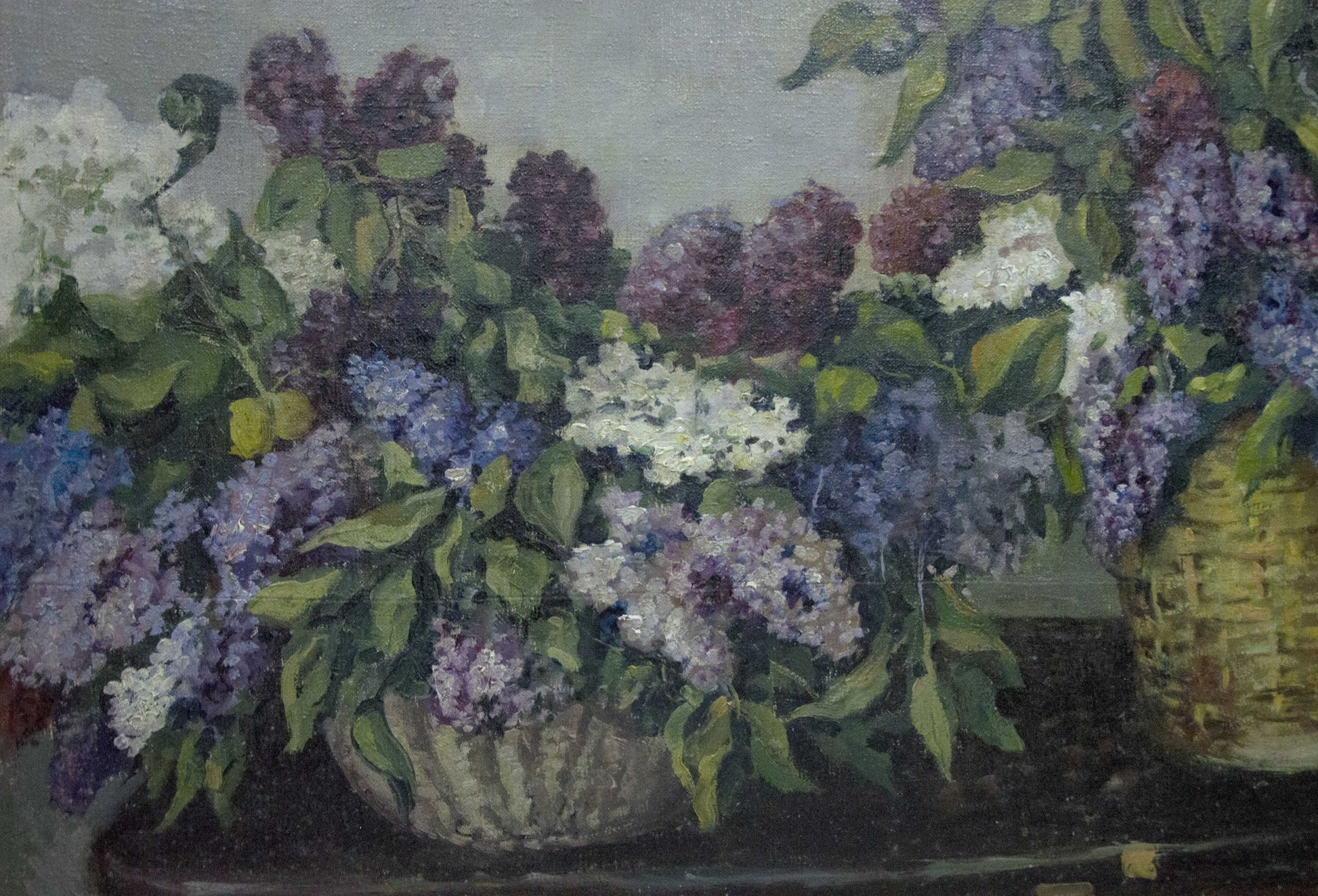 Oil painting of two wicker baskets overflowing with lilac blossoms