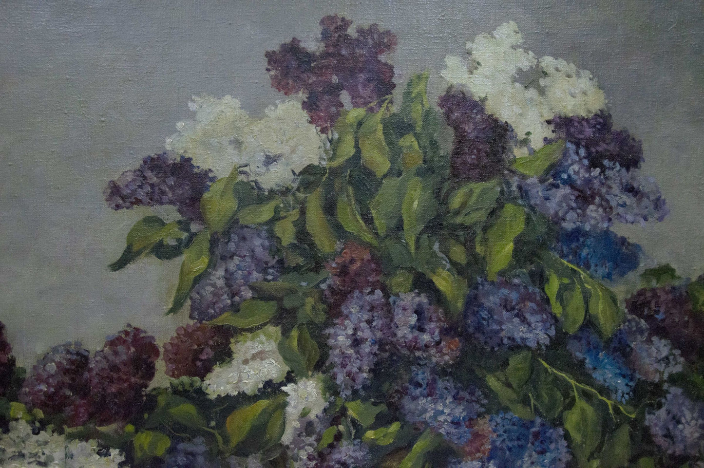 Oil painting of two baskets of lilacs in purple, white, blue with green leaves