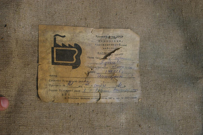 Oil painting back: weathered beige certificate with hammer and sickle logo