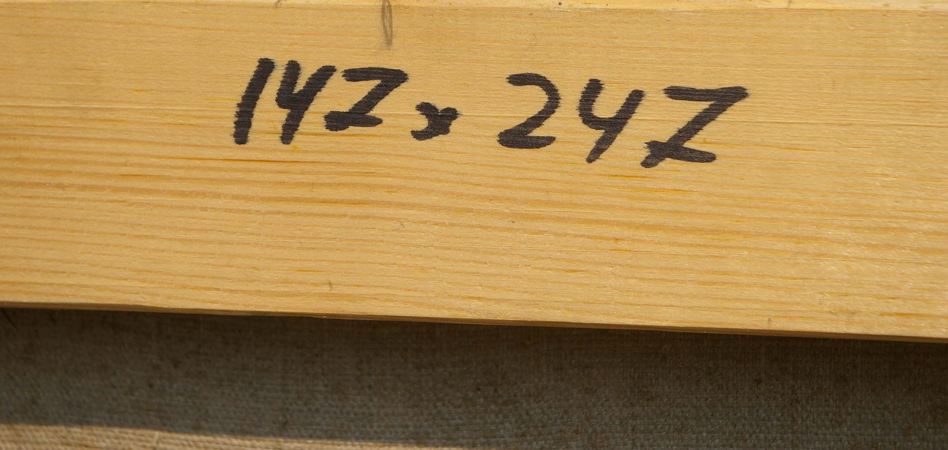 Back of Vladimir Aleksandrovich Budnikov oil painting with light wooden plank and black handwritten markings