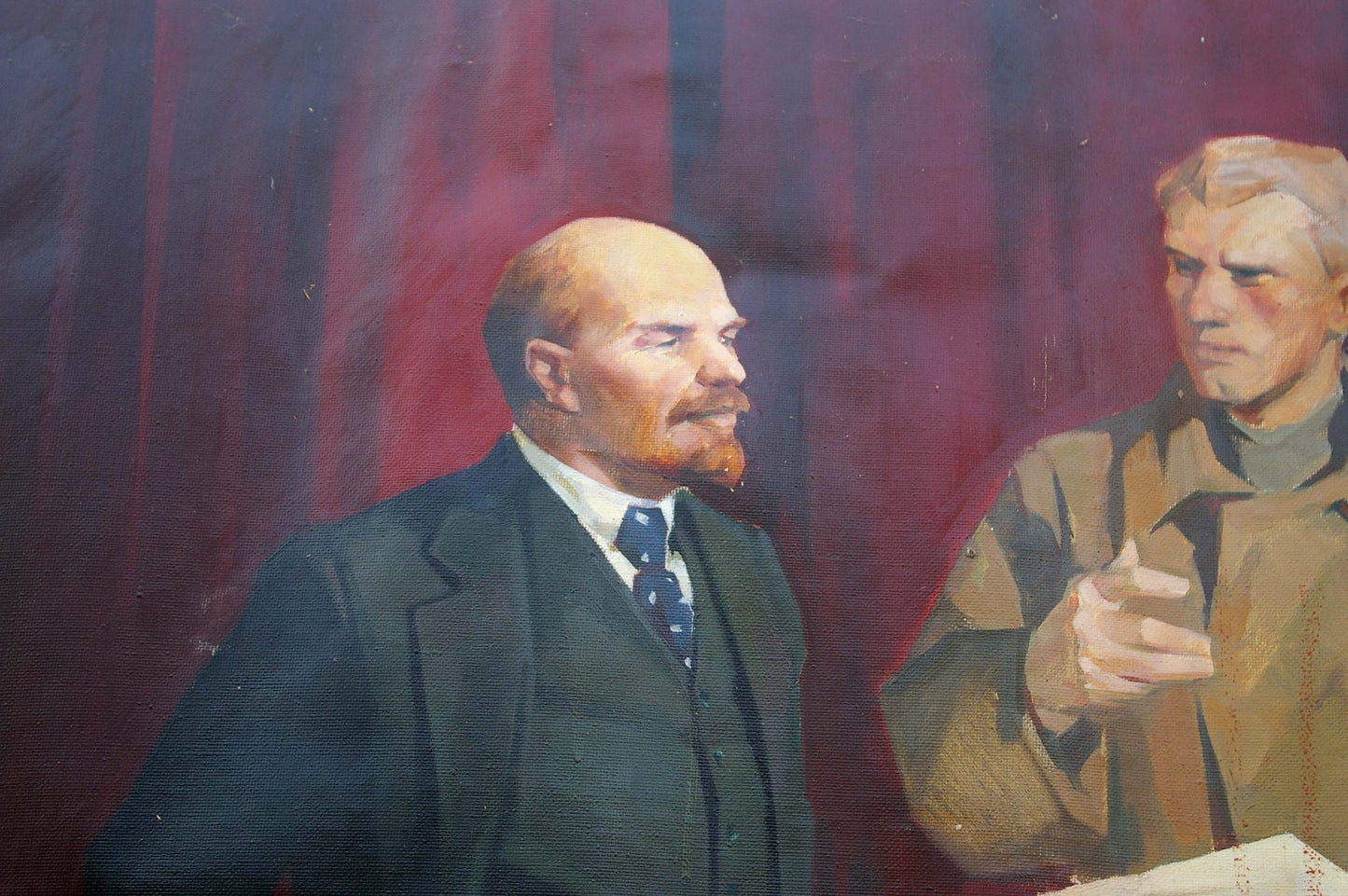 Oil painting of Lenin with Komsomol man in suit, red backdrop
