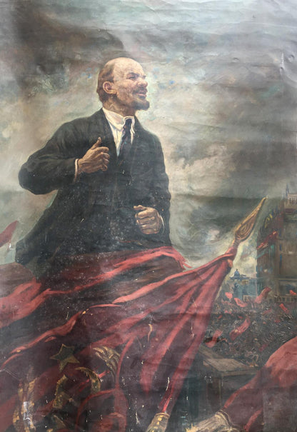 Oil painting of Vladimir Lenin on podium atop red flag with gold stars