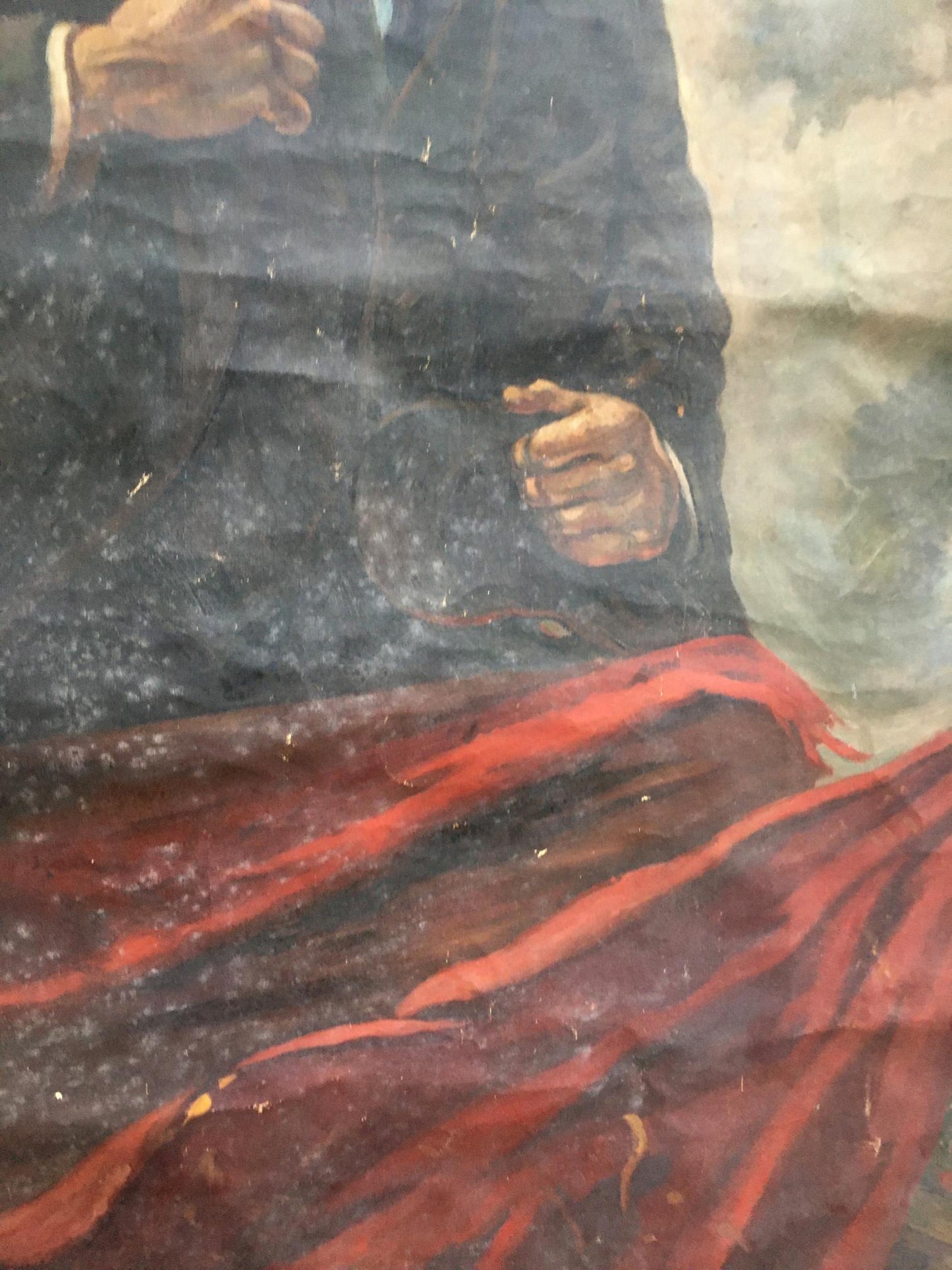 Oil painting of Lenin on podium with dark garment and flowing red fabric