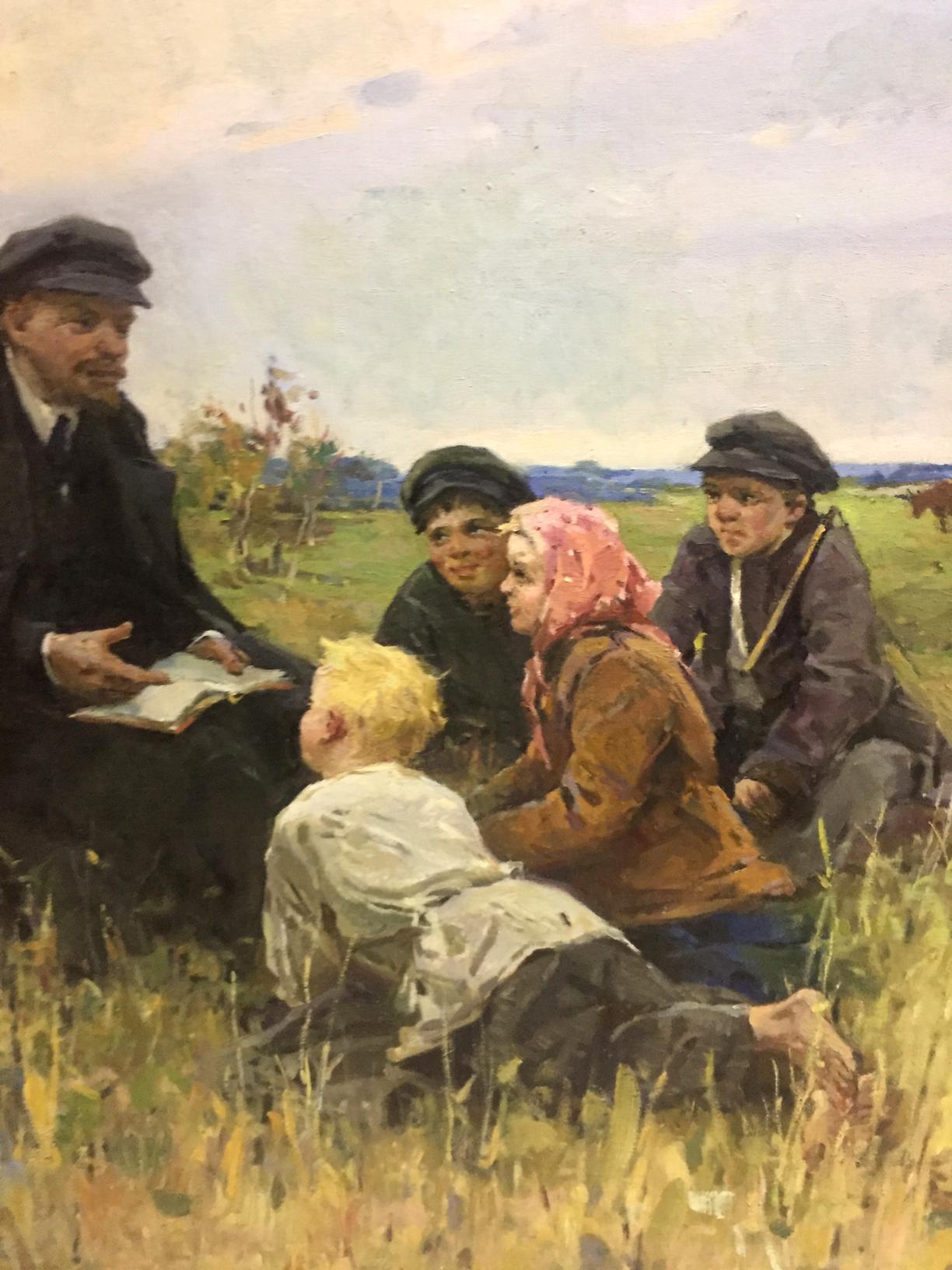 Oil painting of Lenin in suit reading to children by Klimanov Anatoly Alekseevich