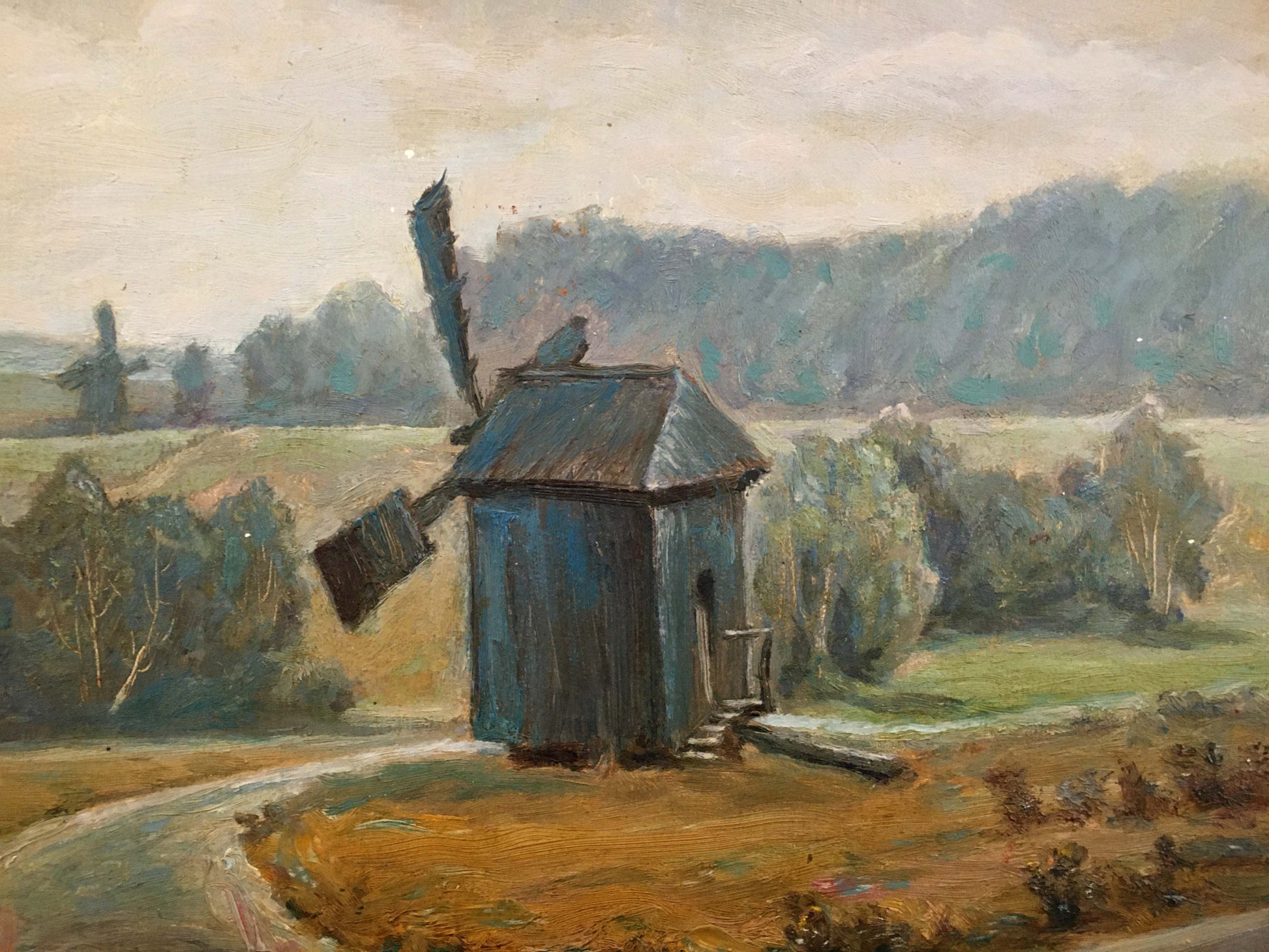 Oil painting of weathered blue windmill in field by Rusin Arkady Viktorovich