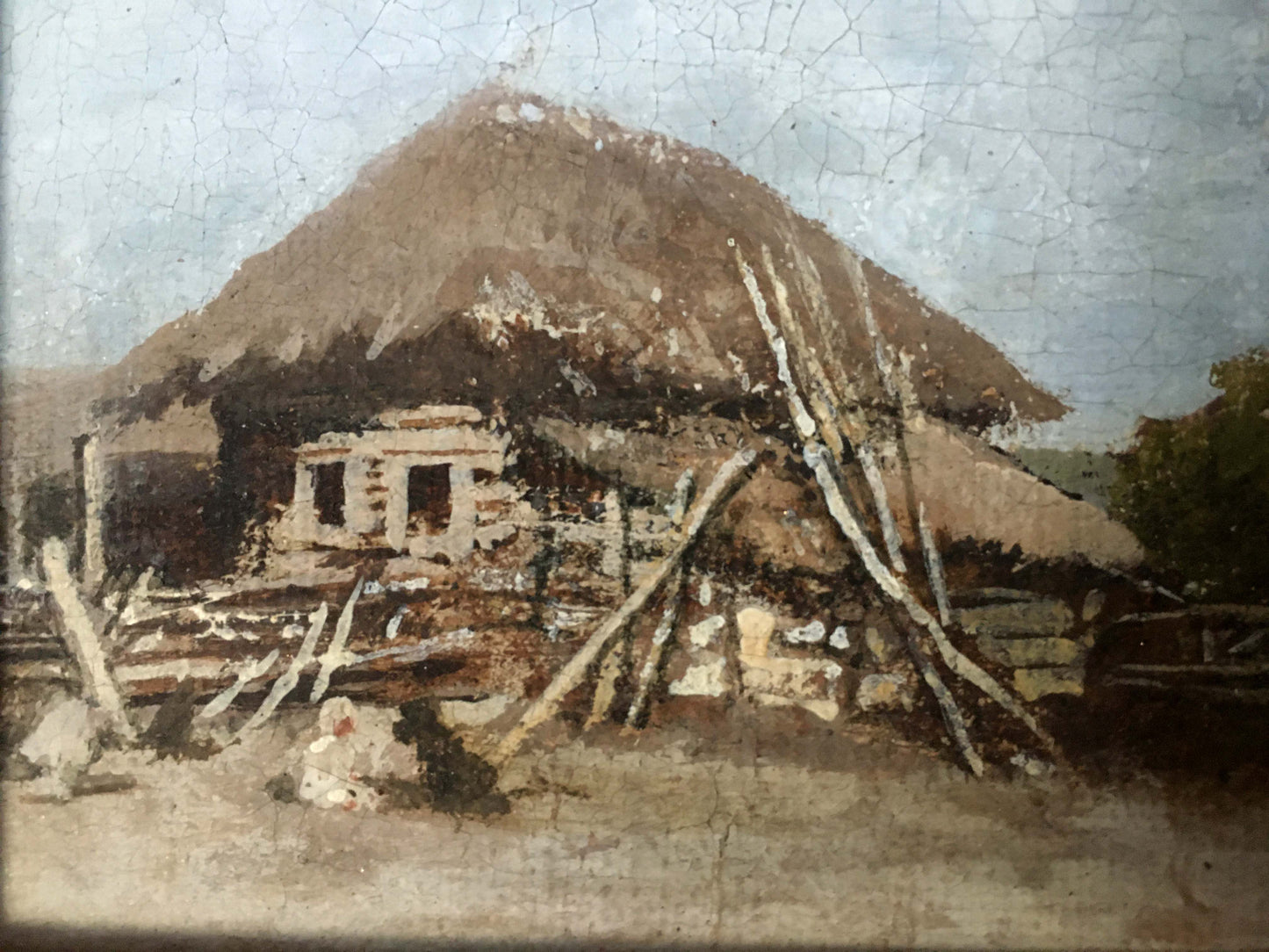 A weathered oil painting depicts a rustic thatched-roof cottage with stone and timber framing, its aged surface showing visible cracks.