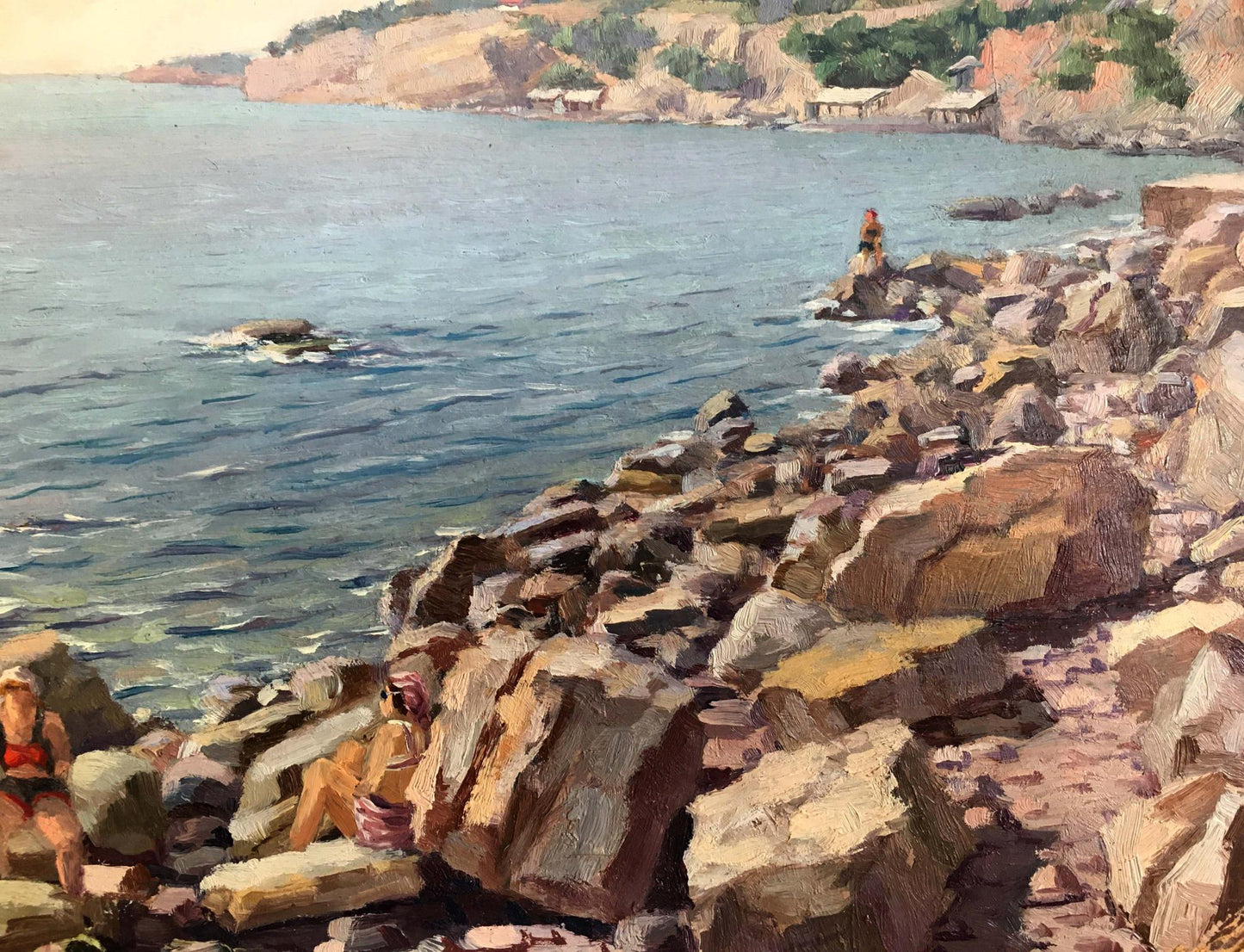 Oil painting of first sun rays on textured rocky sea shoreline with distant cliff