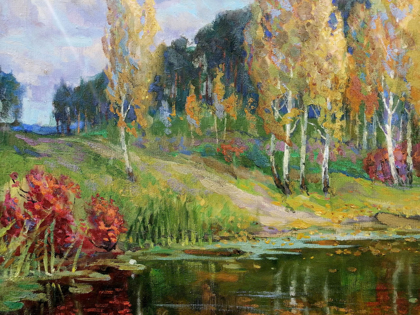 Oil painting by Zhabinsky Leonid Andreevich: autumn birch trees, red bushes, pond, hills