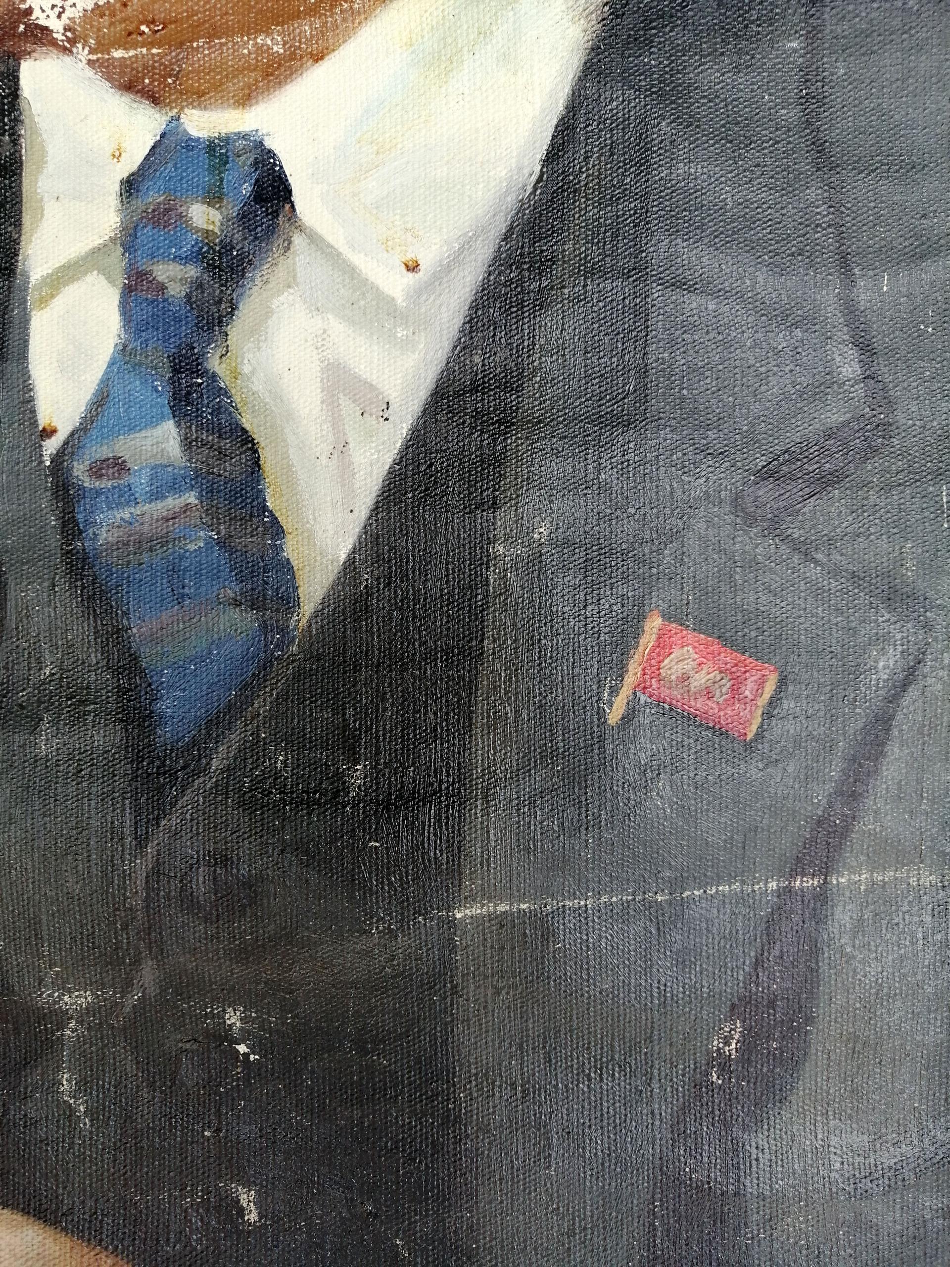 Red gold flag pin on dark gray suit jacket in Lenin portrait painting
