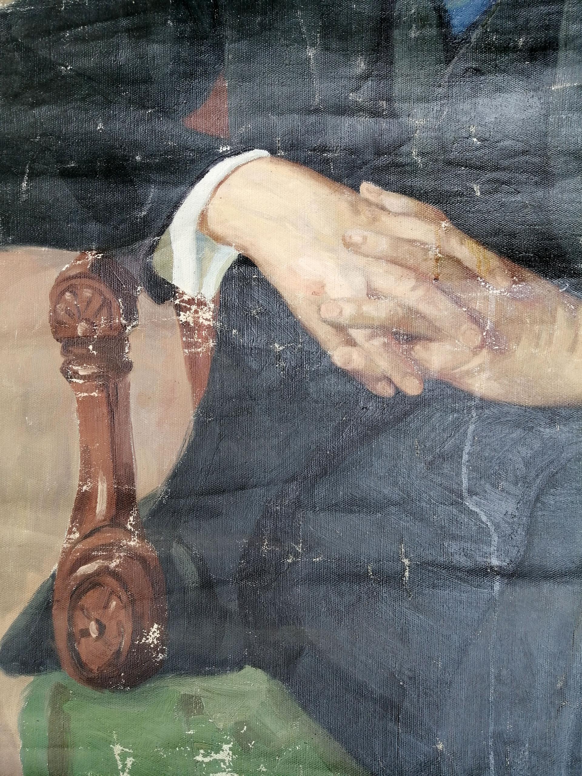 Detail of ornate carved dark wooden chair leg in Lenin portrait painting