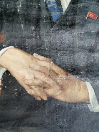 Social realism portrait of Lenin in dark gray suit with red flag pin