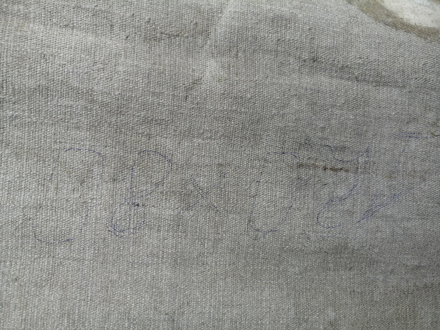 Back of social realism oil portrait of Lenin on gray textured fabric