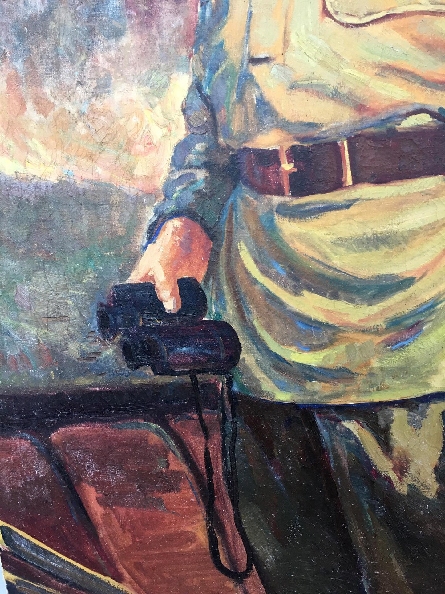 Hand holding black binoculars with strap in green sleeve, Red commander oil painting by Vinokurova Maria Yakovlevna