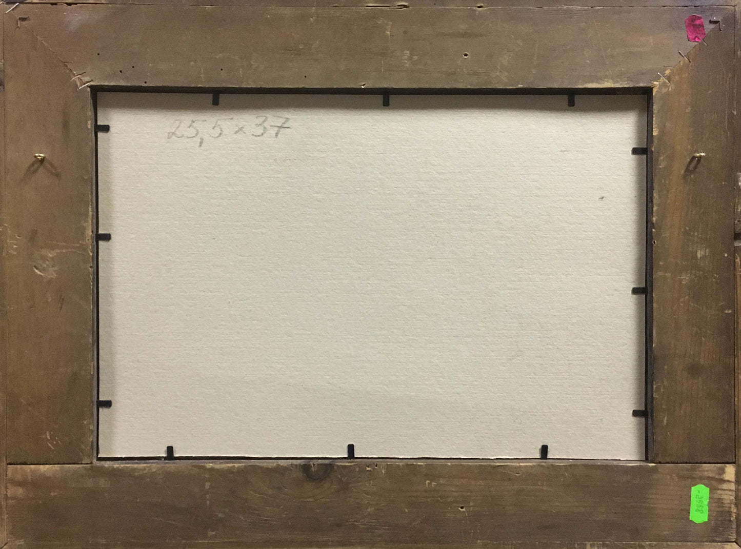 Back of rustic wooden framed oil painting At the station with white canvas and handwritten dimensions