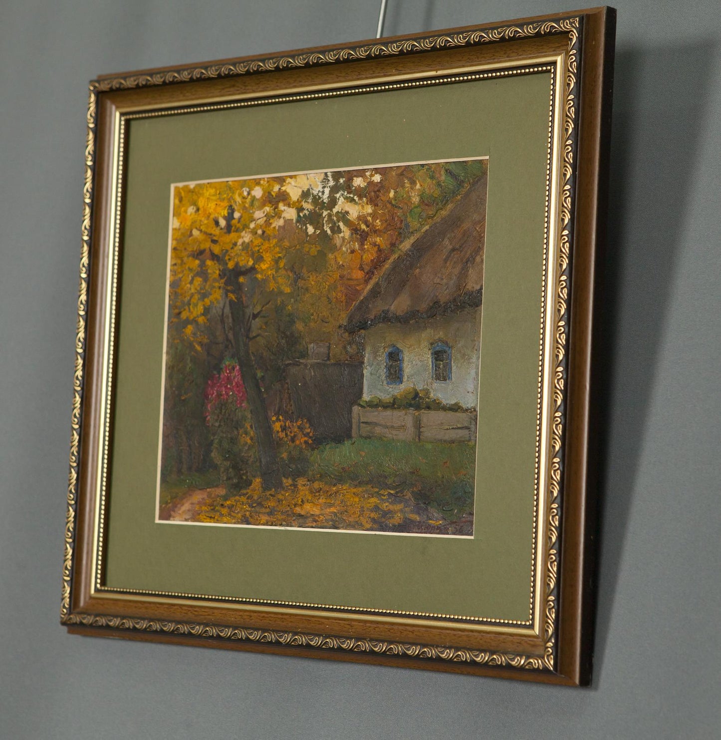 Framed autumn landscape oil painting in gold frame with olive green mat