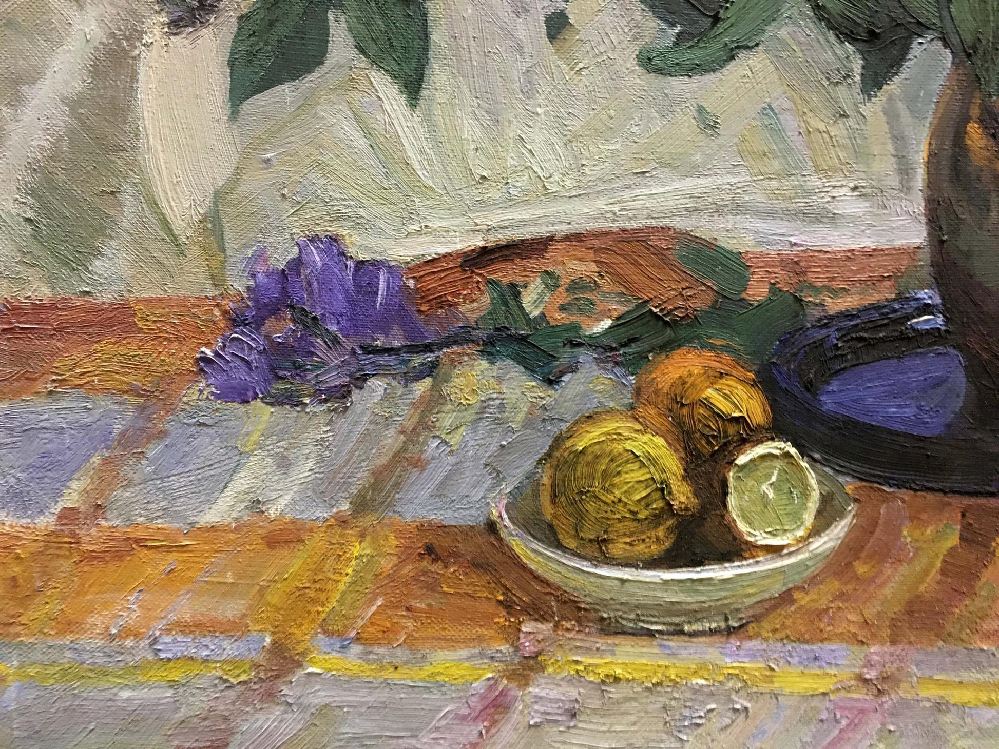 Oil painting of light green bowl with two whole and one halved lemon by Alexander Kerzhner
