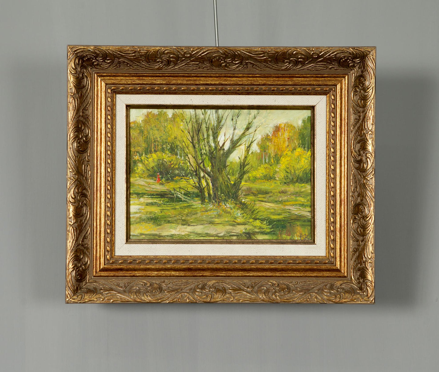Oil painting in the forest: ornate gold-framed autumn landscape