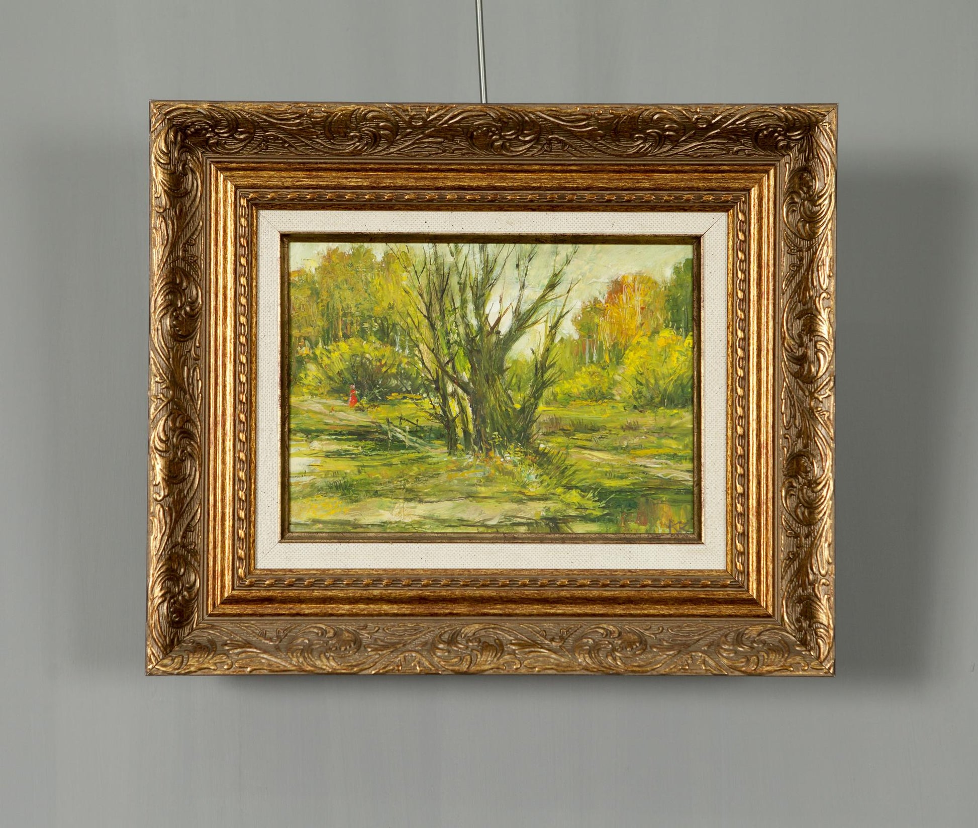 Oil painting in the forest: ornate gold-framed autumn landscape