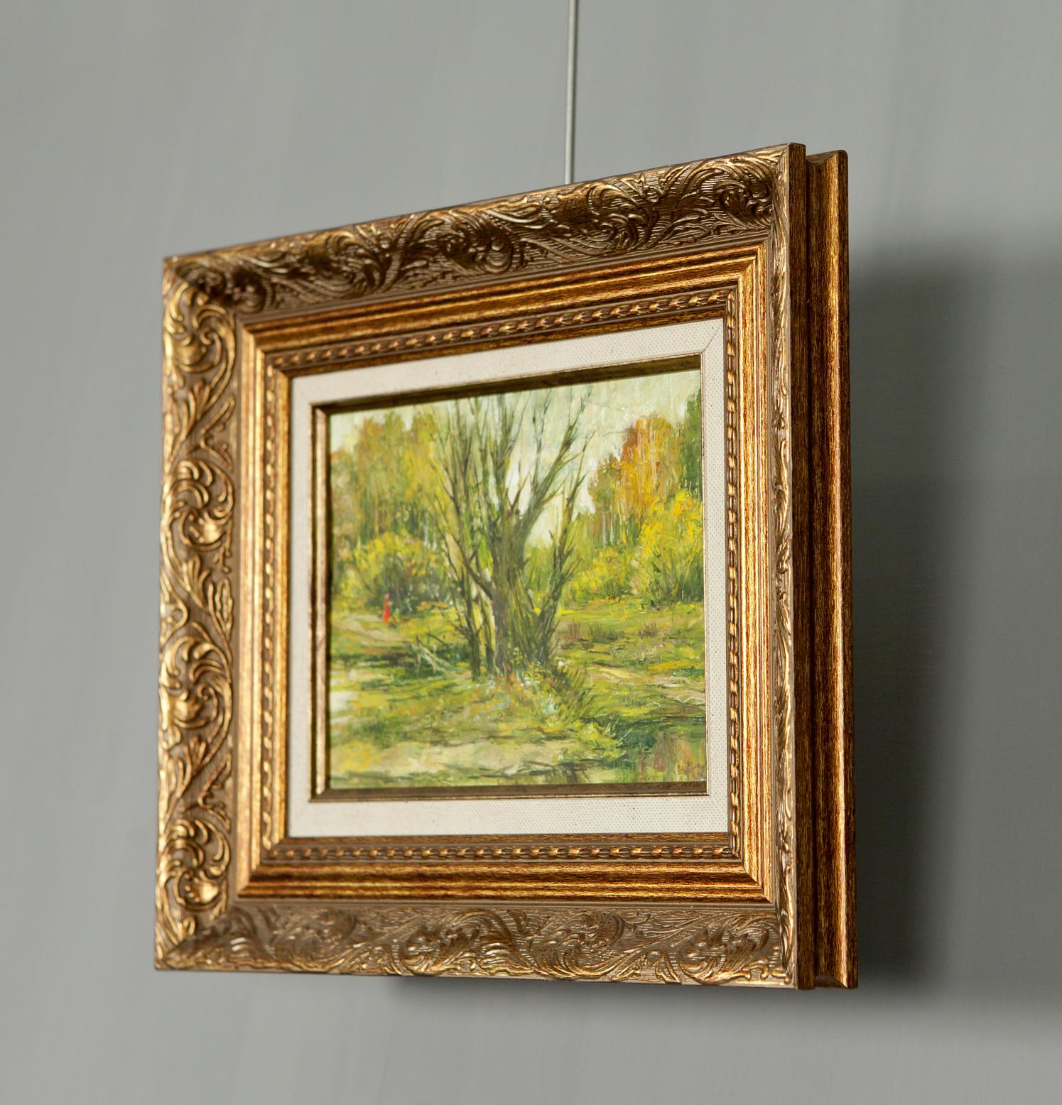 Ornate gold-framed oil painting of serene autumn forest landscape