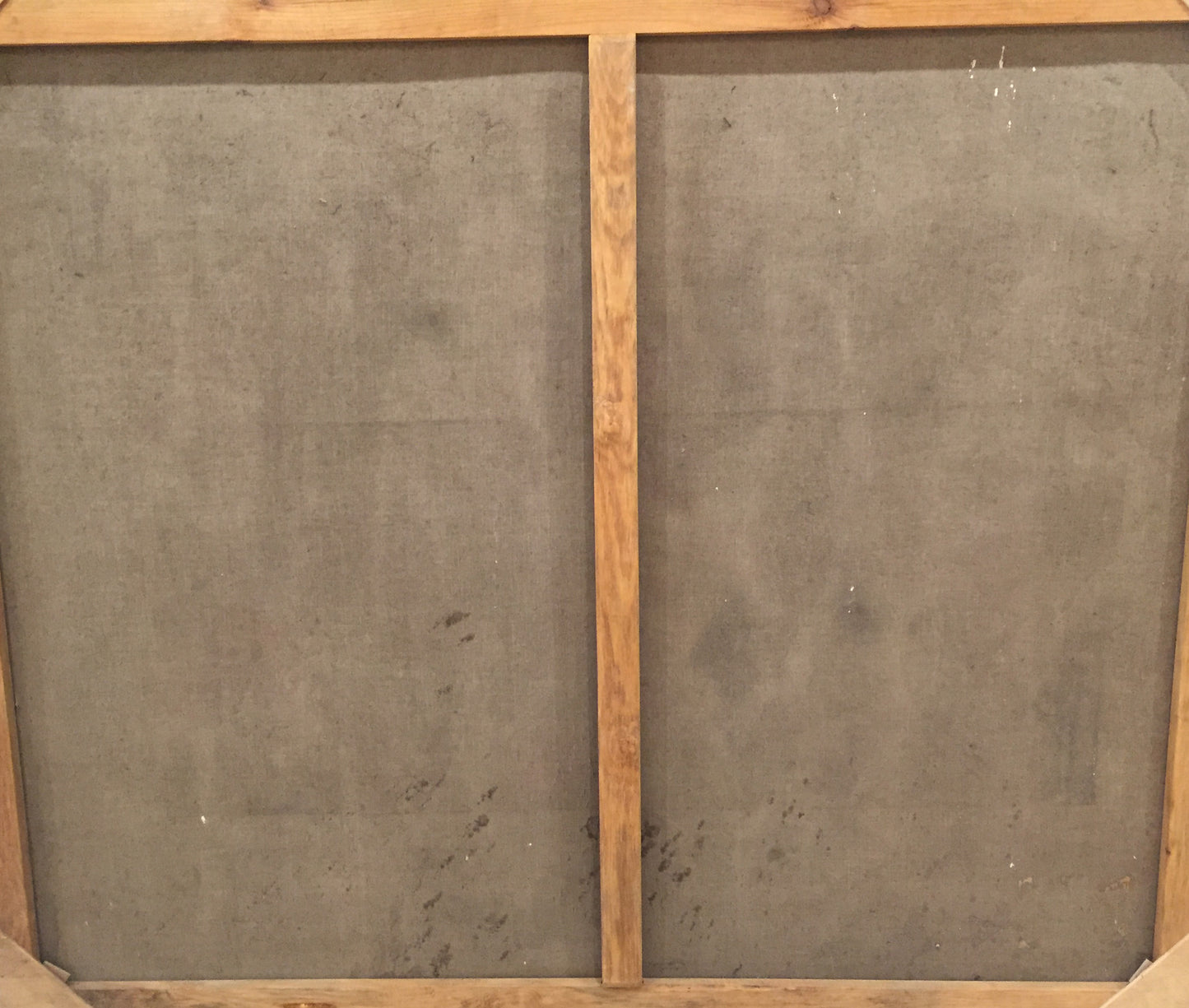 Back of Oil painting Evening gatherings canvas with gray panels and wood grain