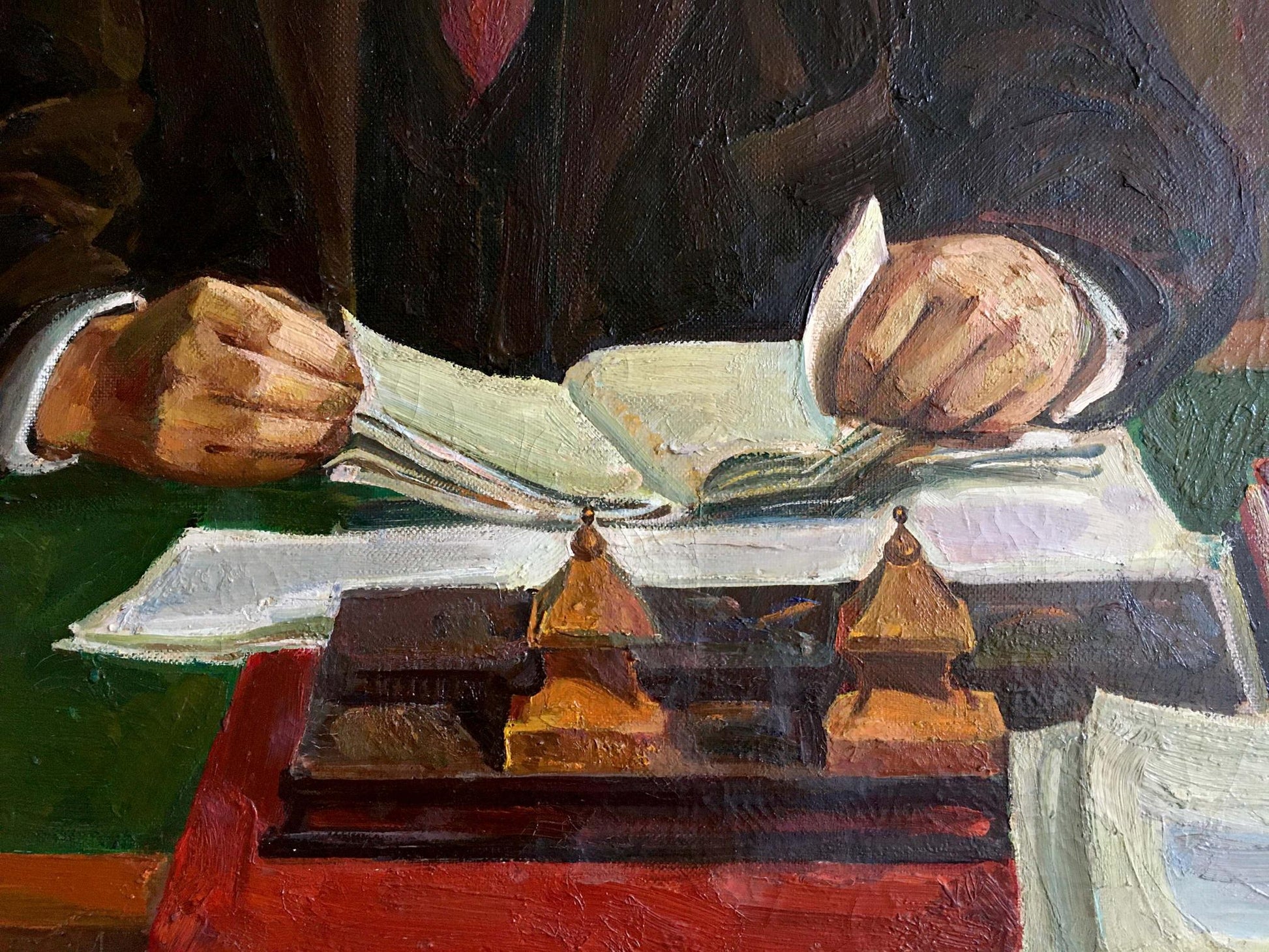 Dark wooden inkwell with golden pagoda lids on red surface in Lenin oil painting