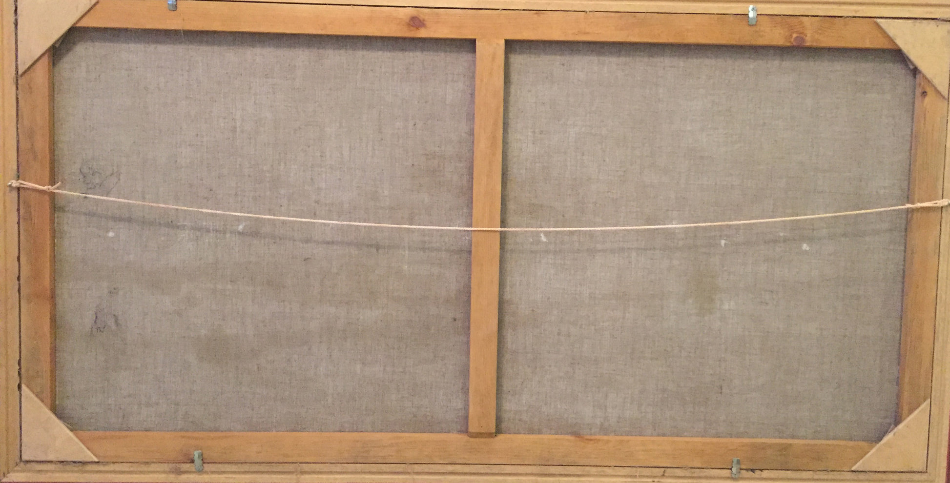 Back of Oil painting Over the Boog P. Taranyuk on light brown wooden frame with gray fabric