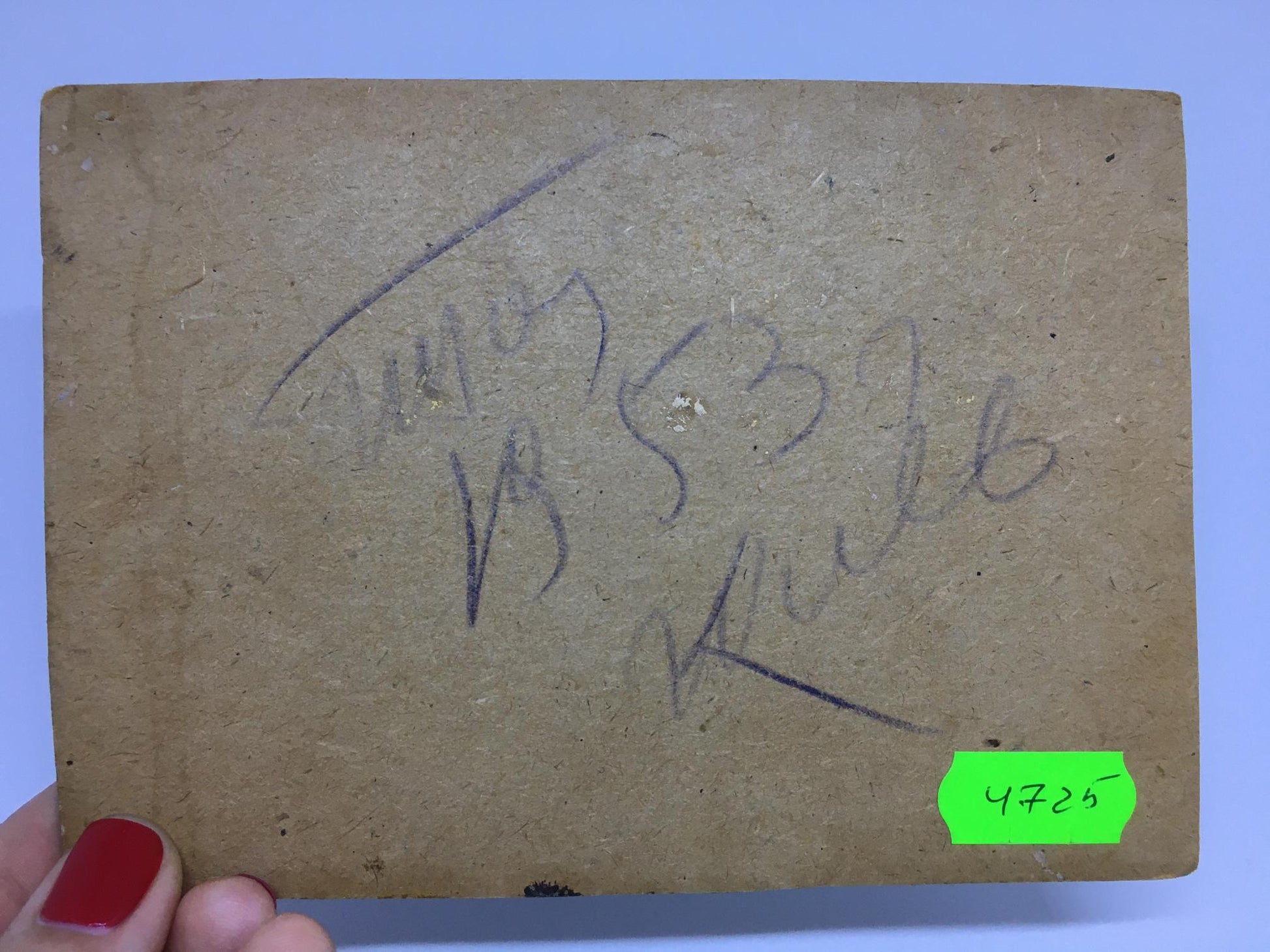 Worn beige box with handwritten marks, green tag for Oil painting Football field I. Popov
