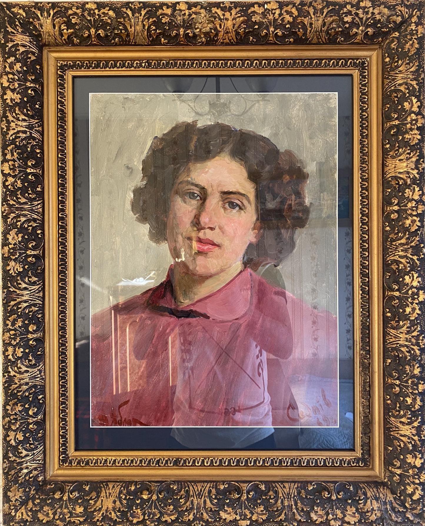 Framed portrait of woman with dark curly hair in pink shirt by Tatiana Nilovna Yablonskaya