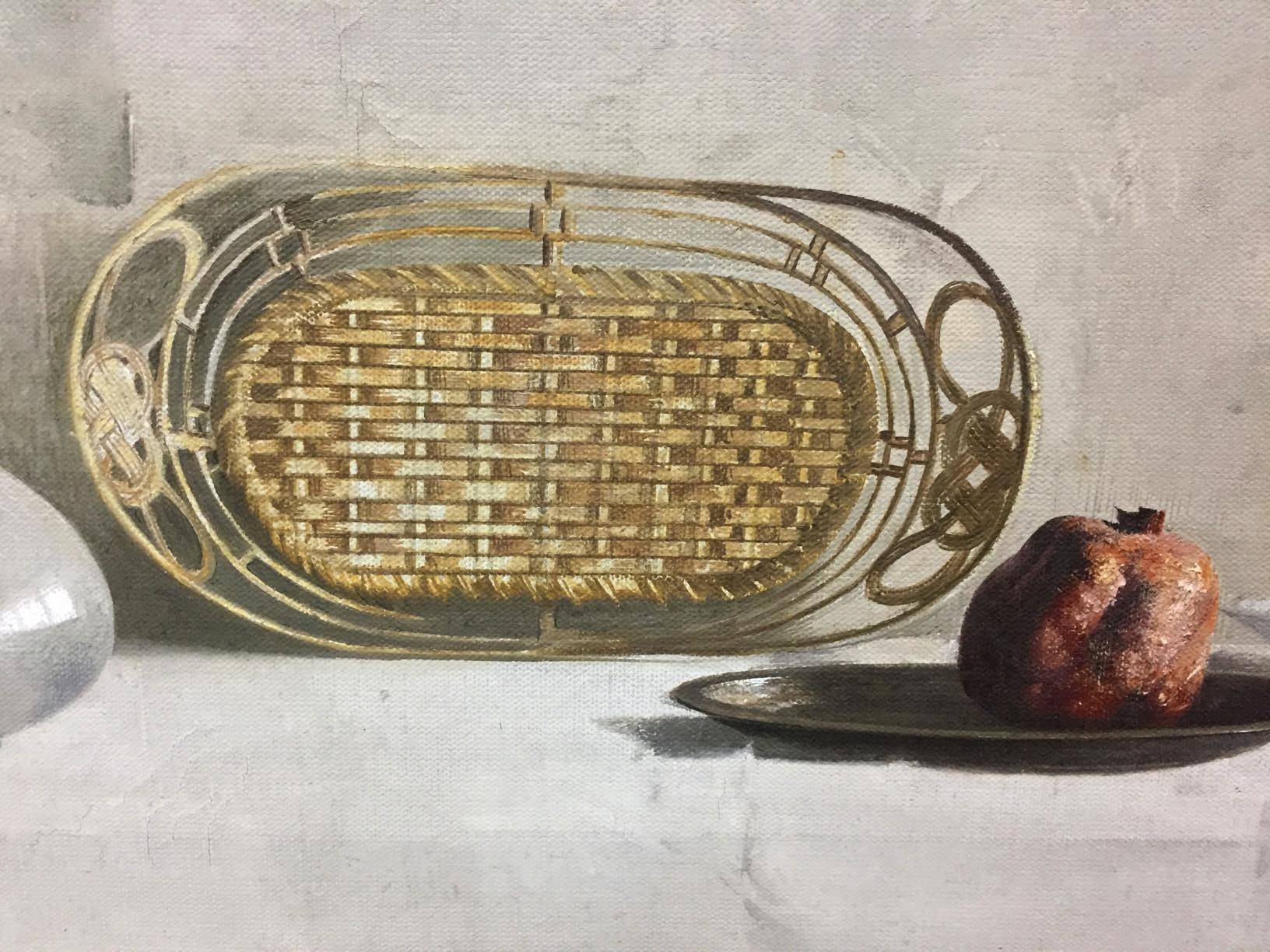 Golden oval woven basket with metal framing in Alexey Vlasov pomegranate still life painting