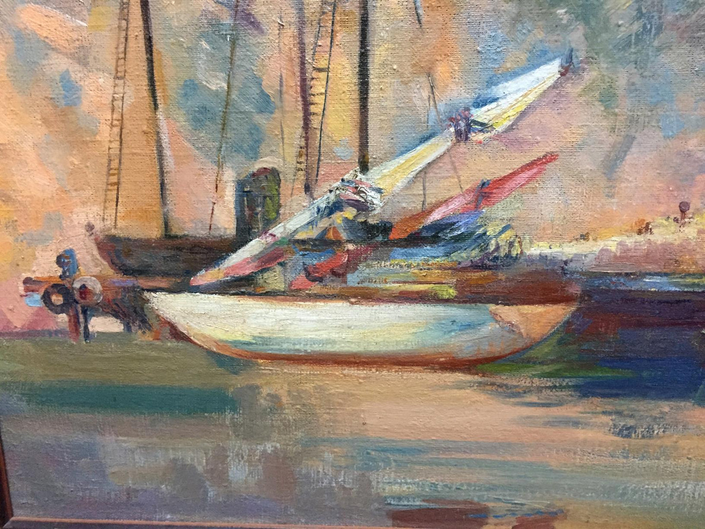 Oil painting of white sailboat with colorful sails docked under impressionistic sky