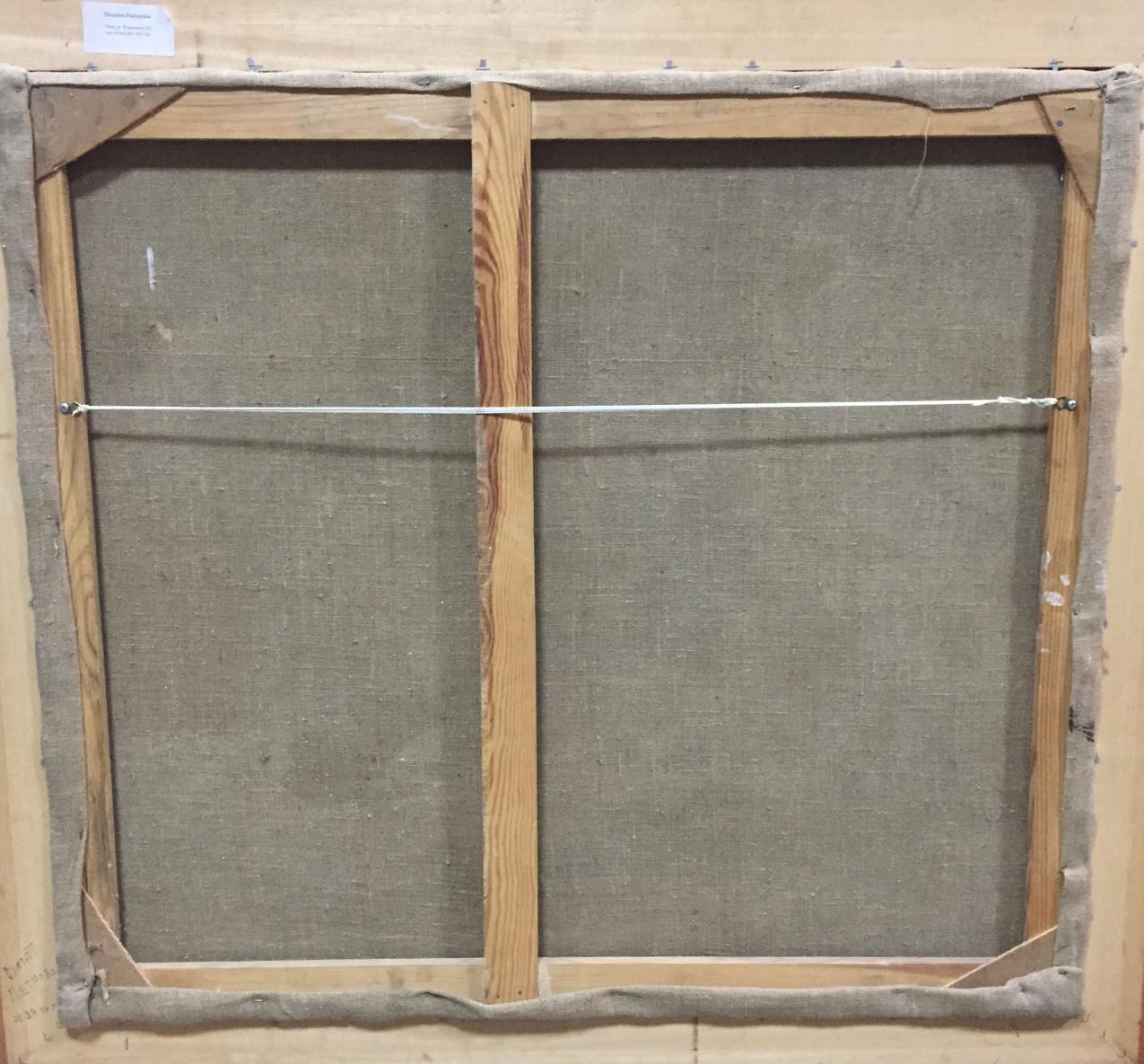 Back of framed oil painting canvas with light wood bars and gray backing