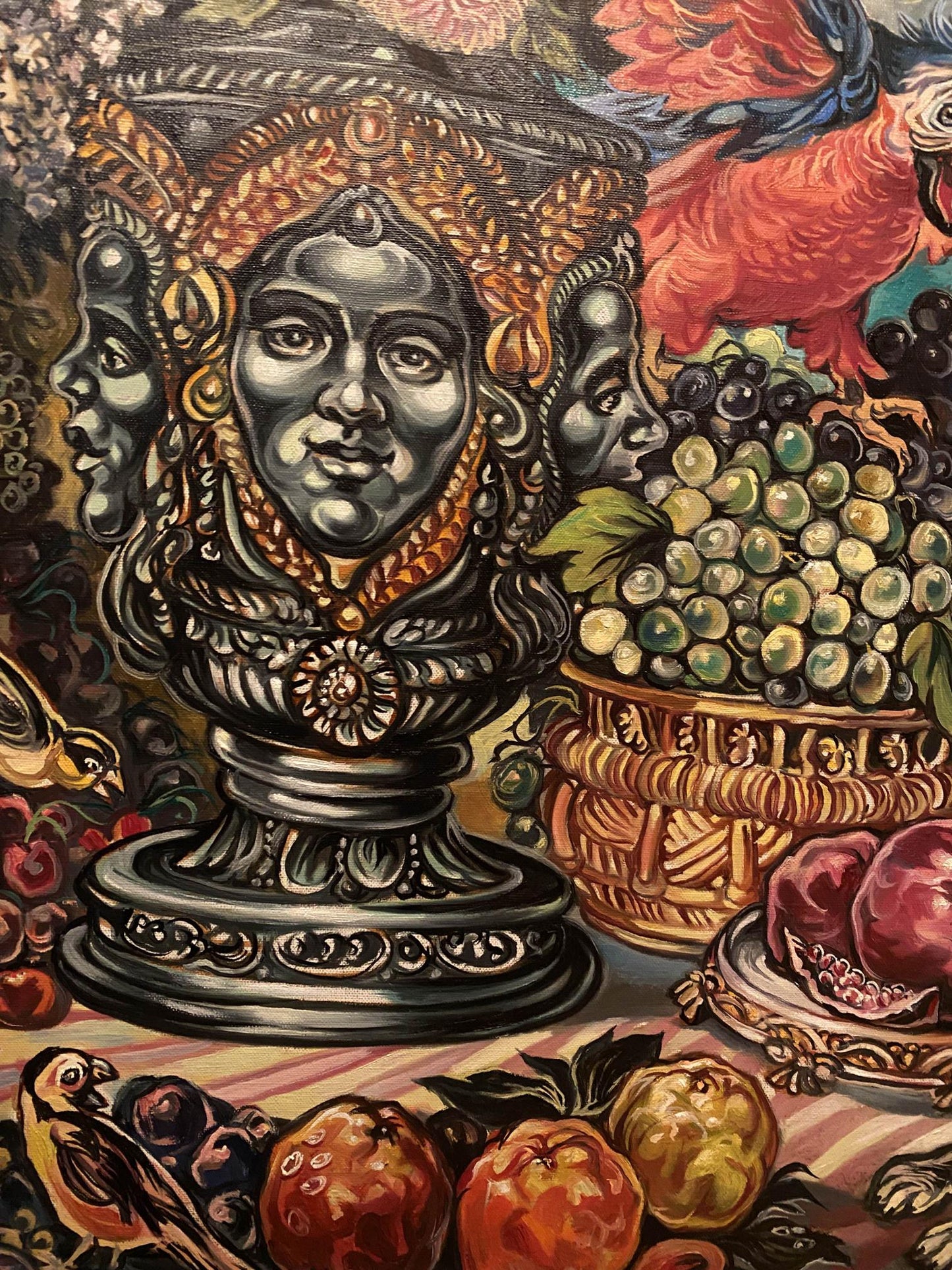 Dark ornate three-faced bust in gold detail, Litvinov parrot still life painting