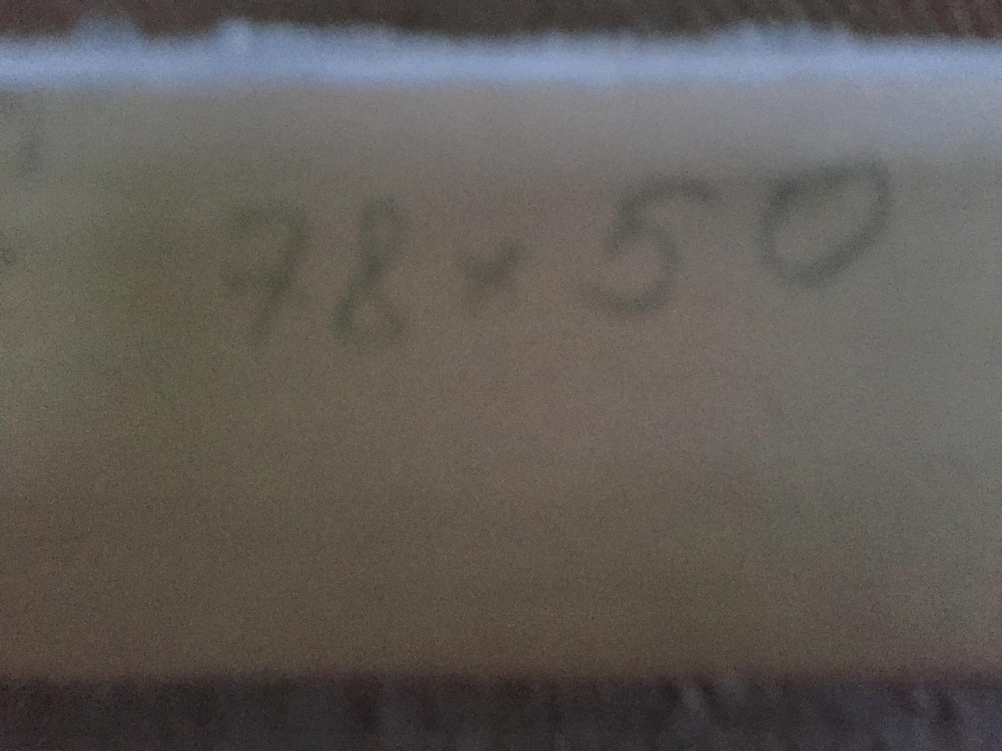 Back of beige cylindrical oil painting copy of girl and guy with handwritten markings