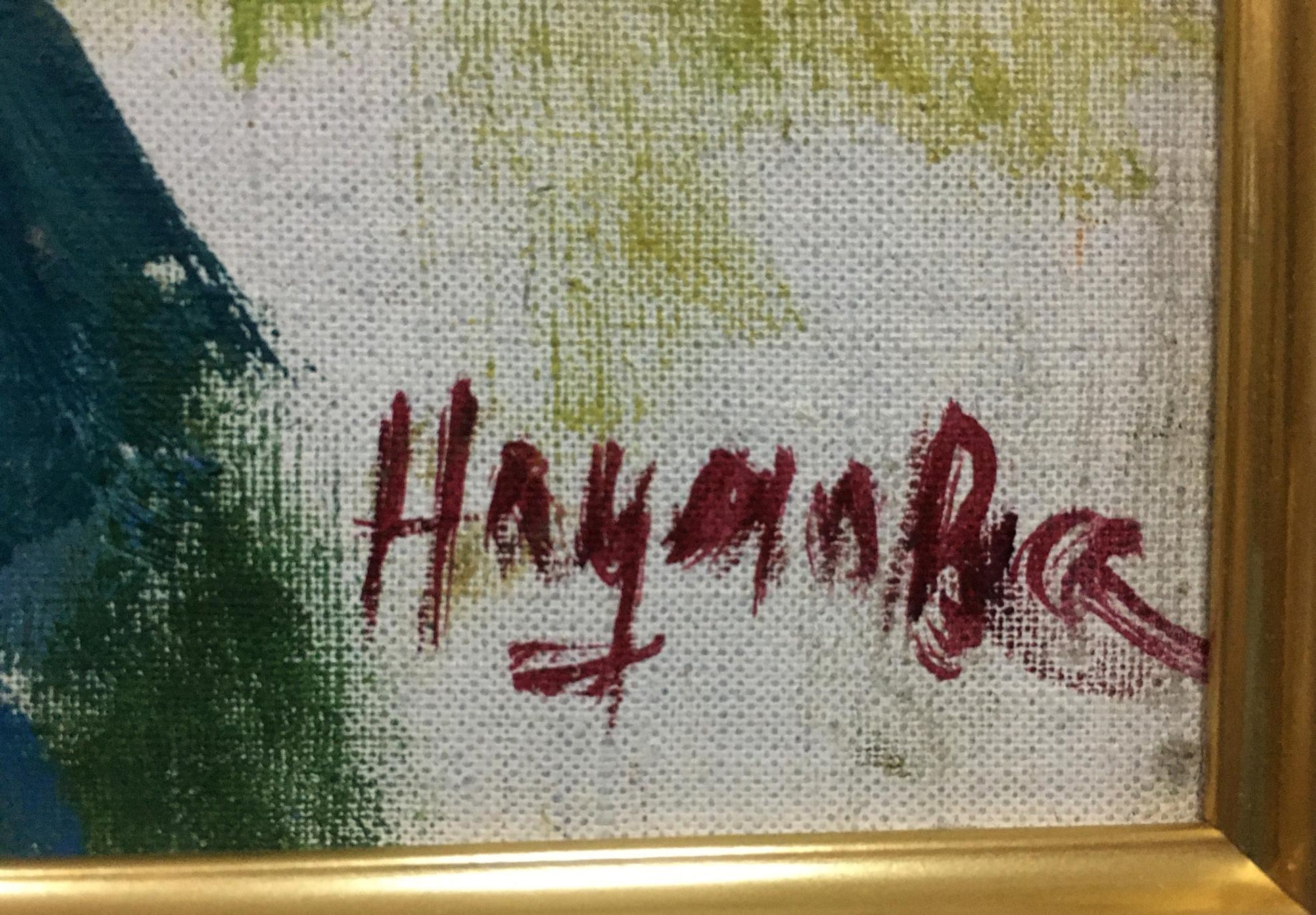 Red cursive signature on textured canvas back of Naumova Tamara Sergeevna oil portrait under gold frame