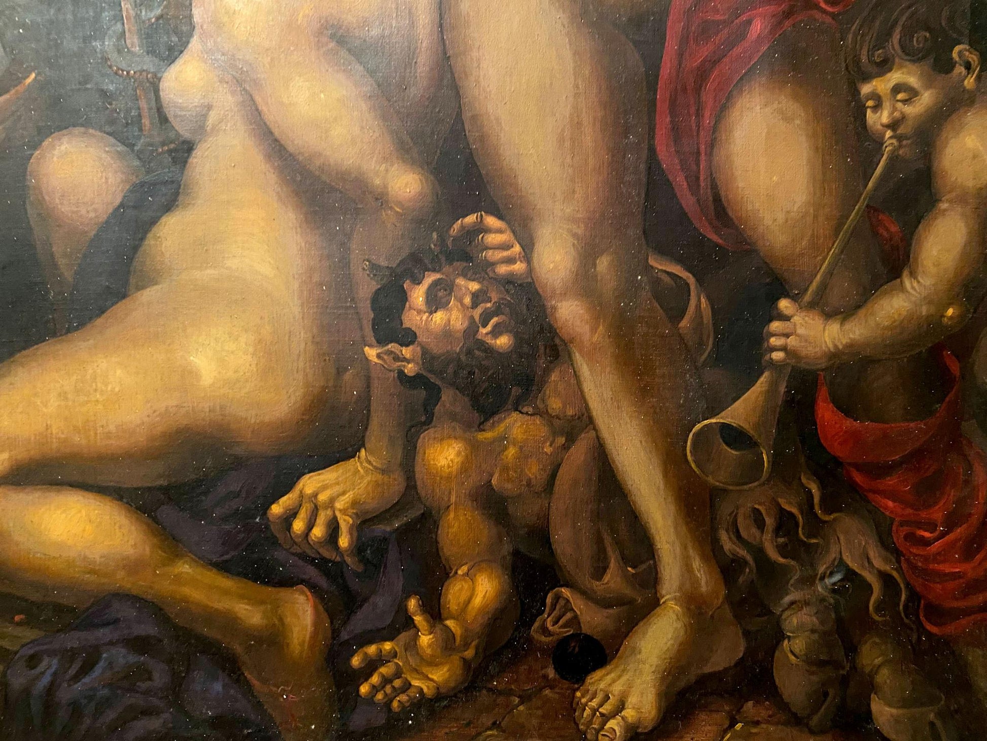 Muscular bearded demon with golden skin under nude figure in Oleg Litvinov oil painting