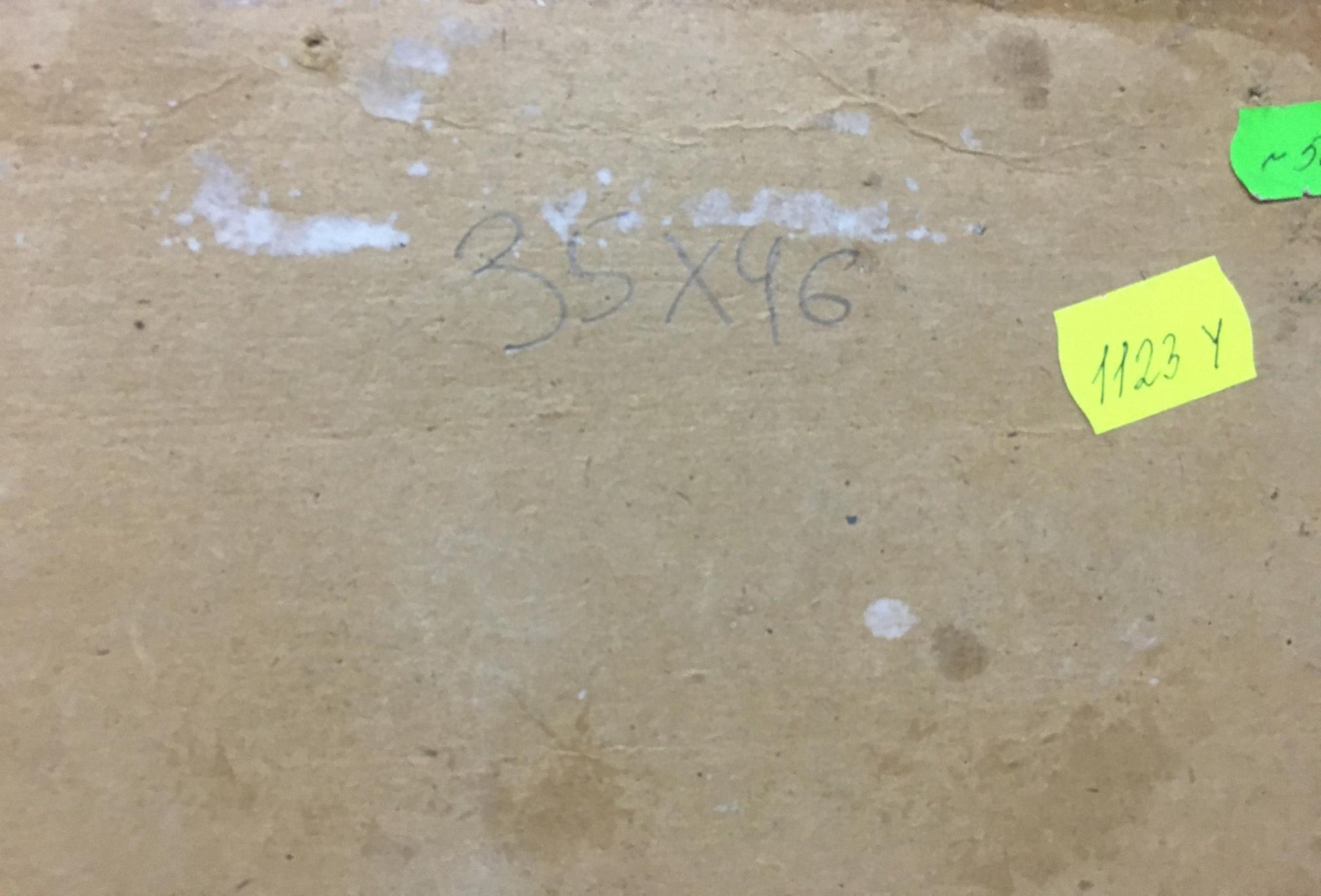 Back of Oil painting Boat mooring with handwritten measurements and labels on brown cardboard