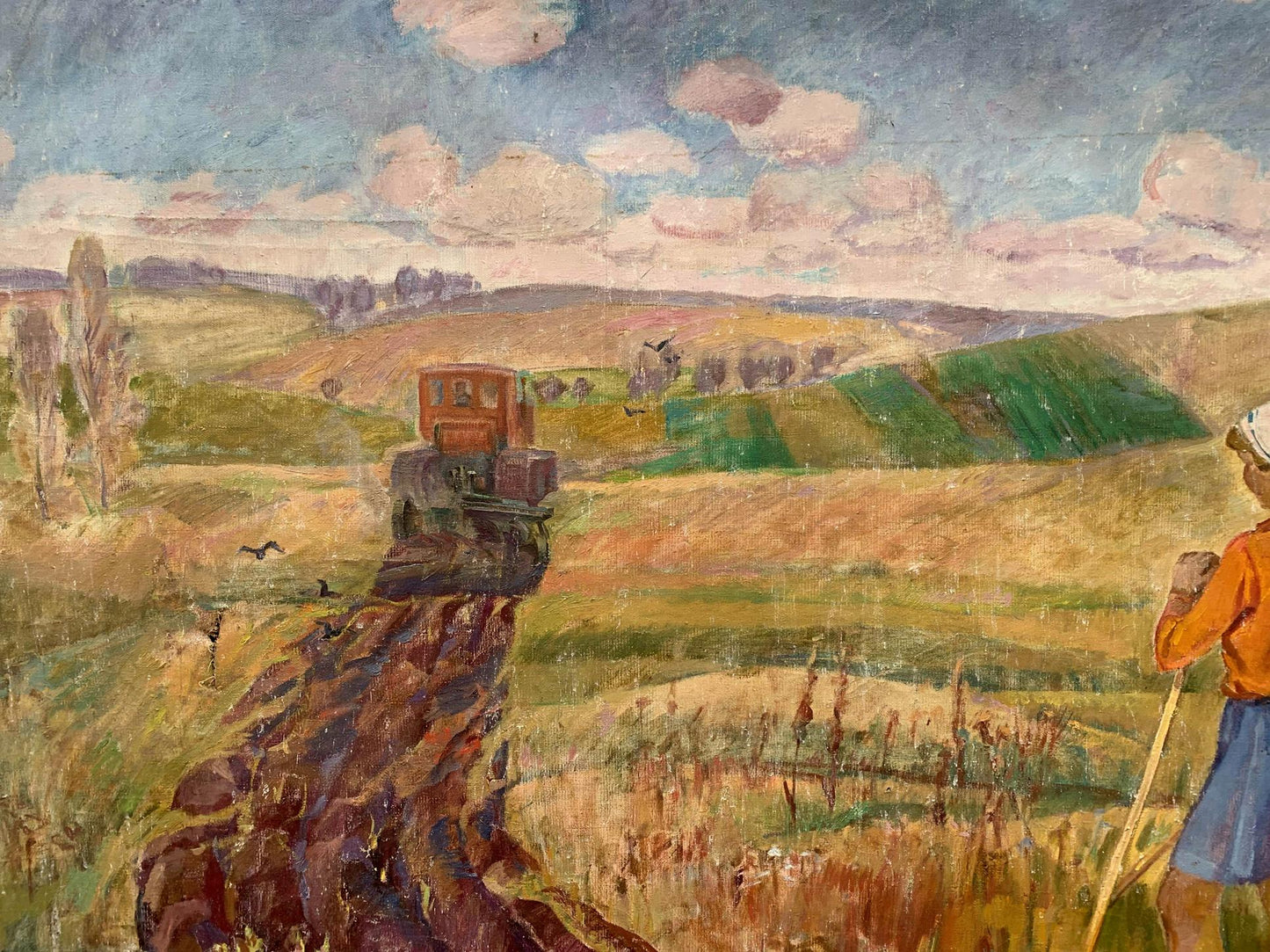 Social realism oil painting Days on the field by Barinova-Kuleba Vera Ivanovna: red and black tractor plowing under cloudy sky