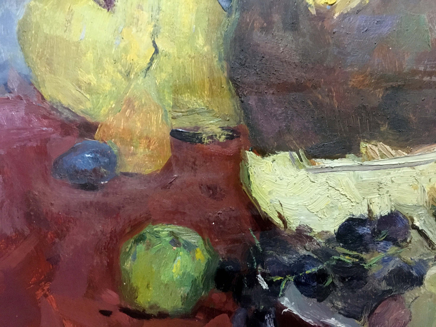 Oil painting by Skubko Sergey Mikhailovich: purple grapes, green apple, yellow pears on red surface