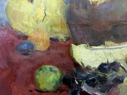 Oil painting by Skubko Sergey Mikhailovich: purple grapes, green apple, yellow pears on red surface