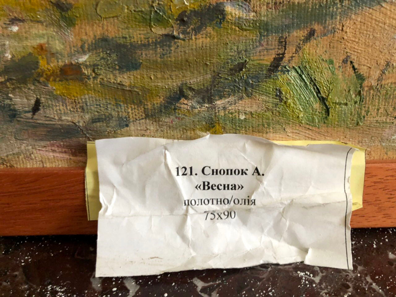 Back of Oil painting Spring Snopok A.N. with crumpled white label on wooden frame